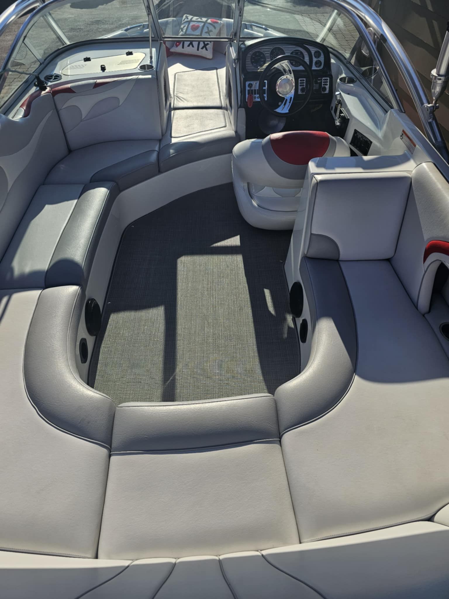 Interior of a 2006 MB PIGPR boat with gray upholstery.