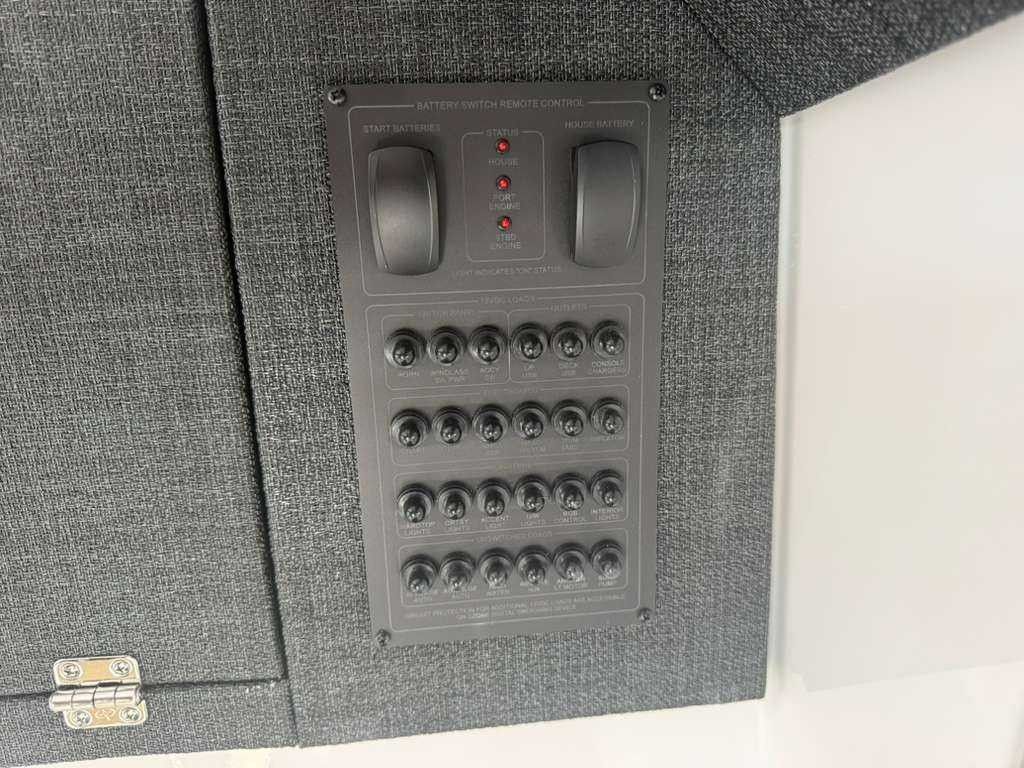Control panel with multiple switches and indicator lights.