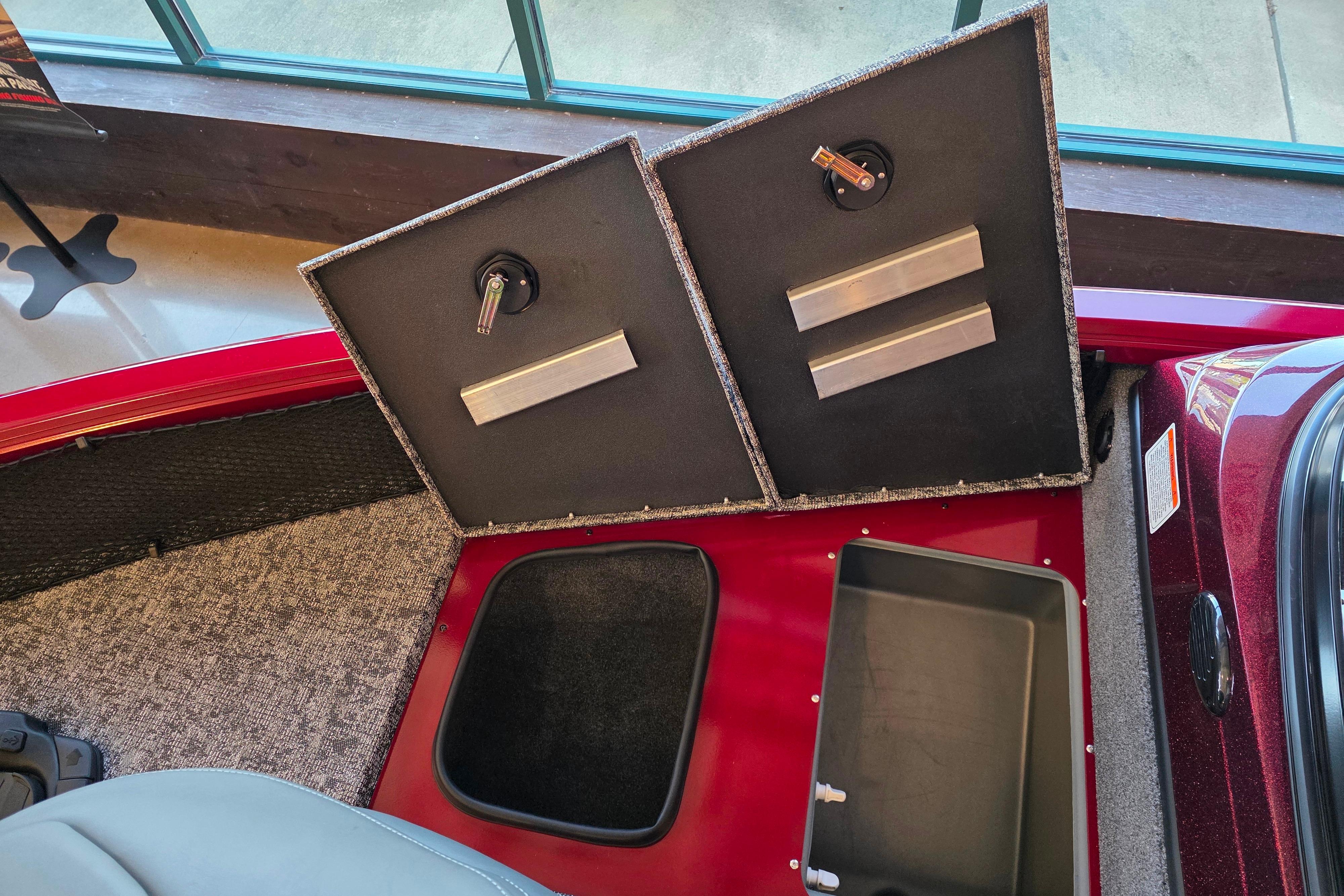 2026 Ranger VS1782SC Reata boat storage compartments with open lids, showcasing interior design.