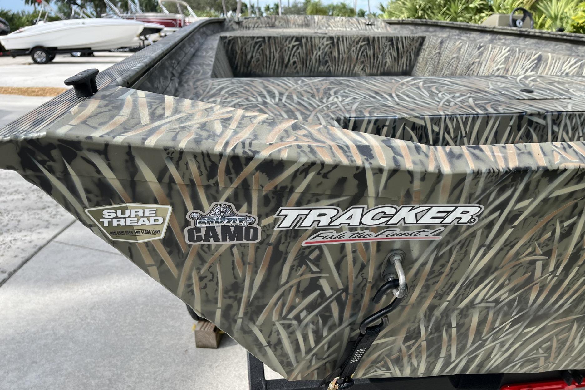 2025 Tracker Grizzly 1860 Utility boat with camo design and Sure Tread feature.