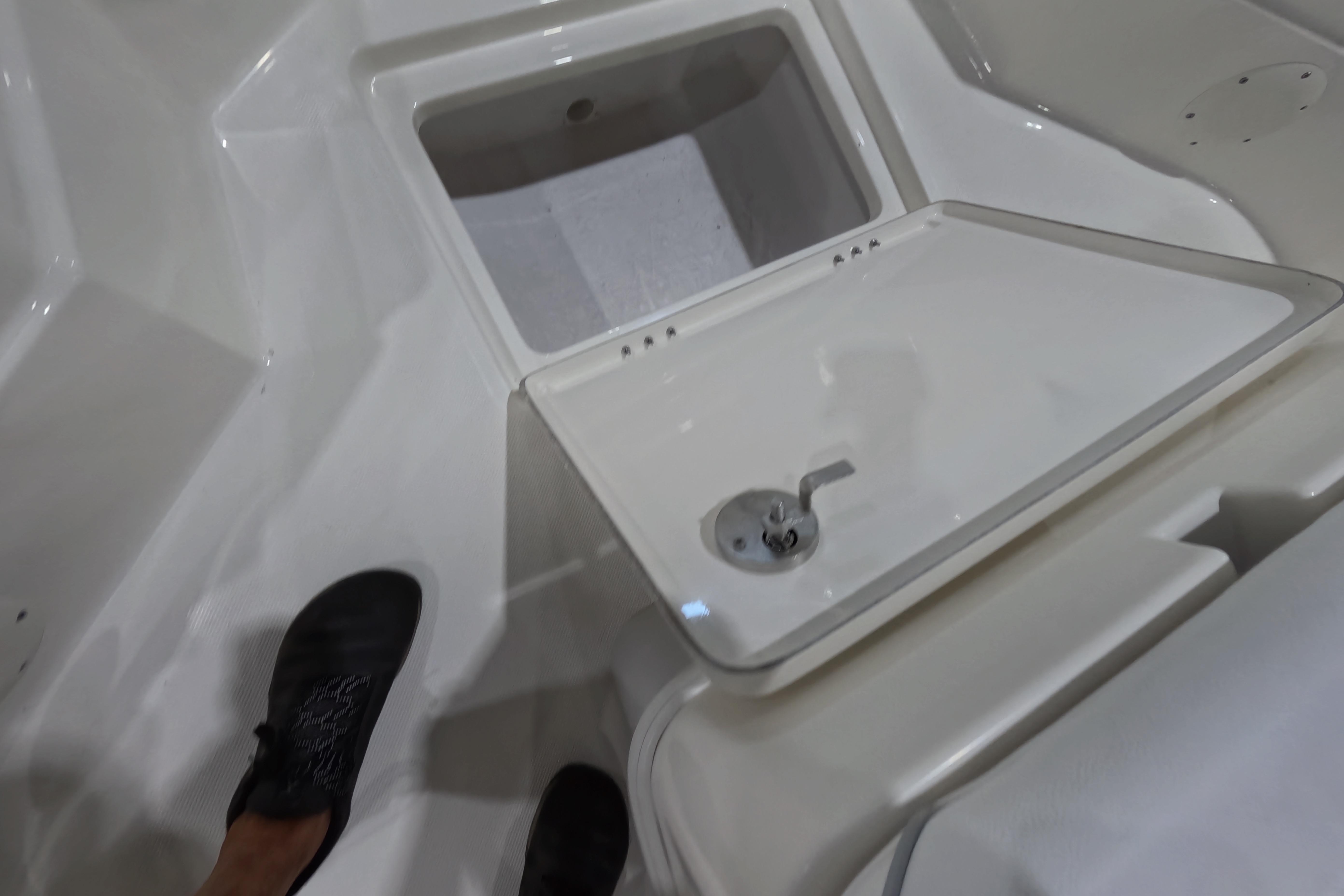 Interior view of 2026 Skeeter SX230 boat with open storage compartment.