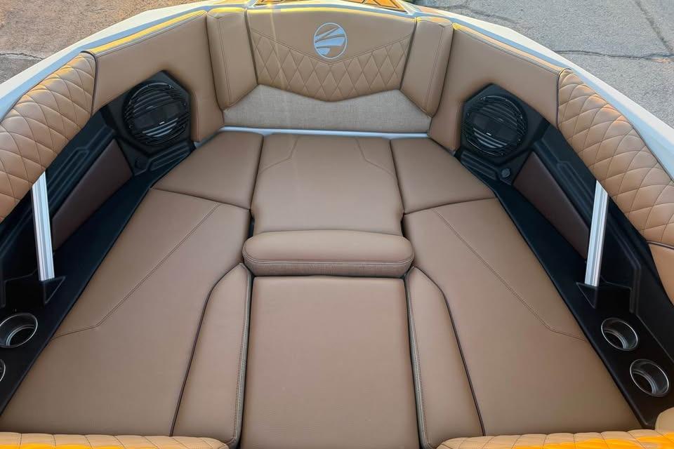 Luxurious interior of 2026 Tigé Z3 boat with tan leather seating and speakers.