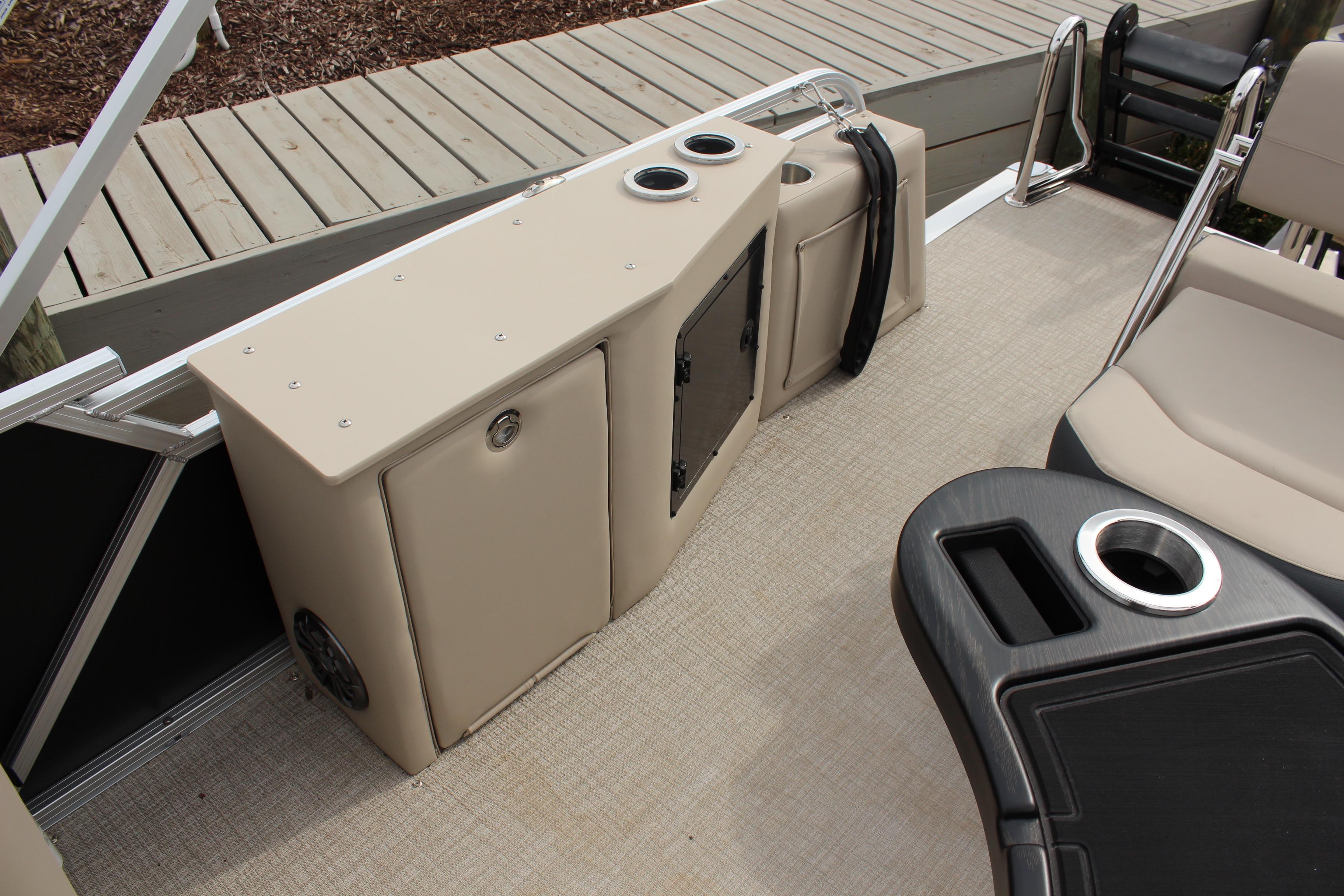 2026 Tahoe Pontoon LTZ interior with seating, storage, and cup holders.