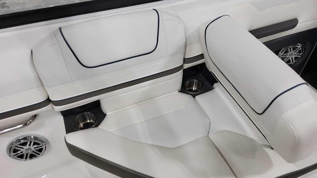 2025 Formula 240 Bowrider interior with white seating and cup holders.