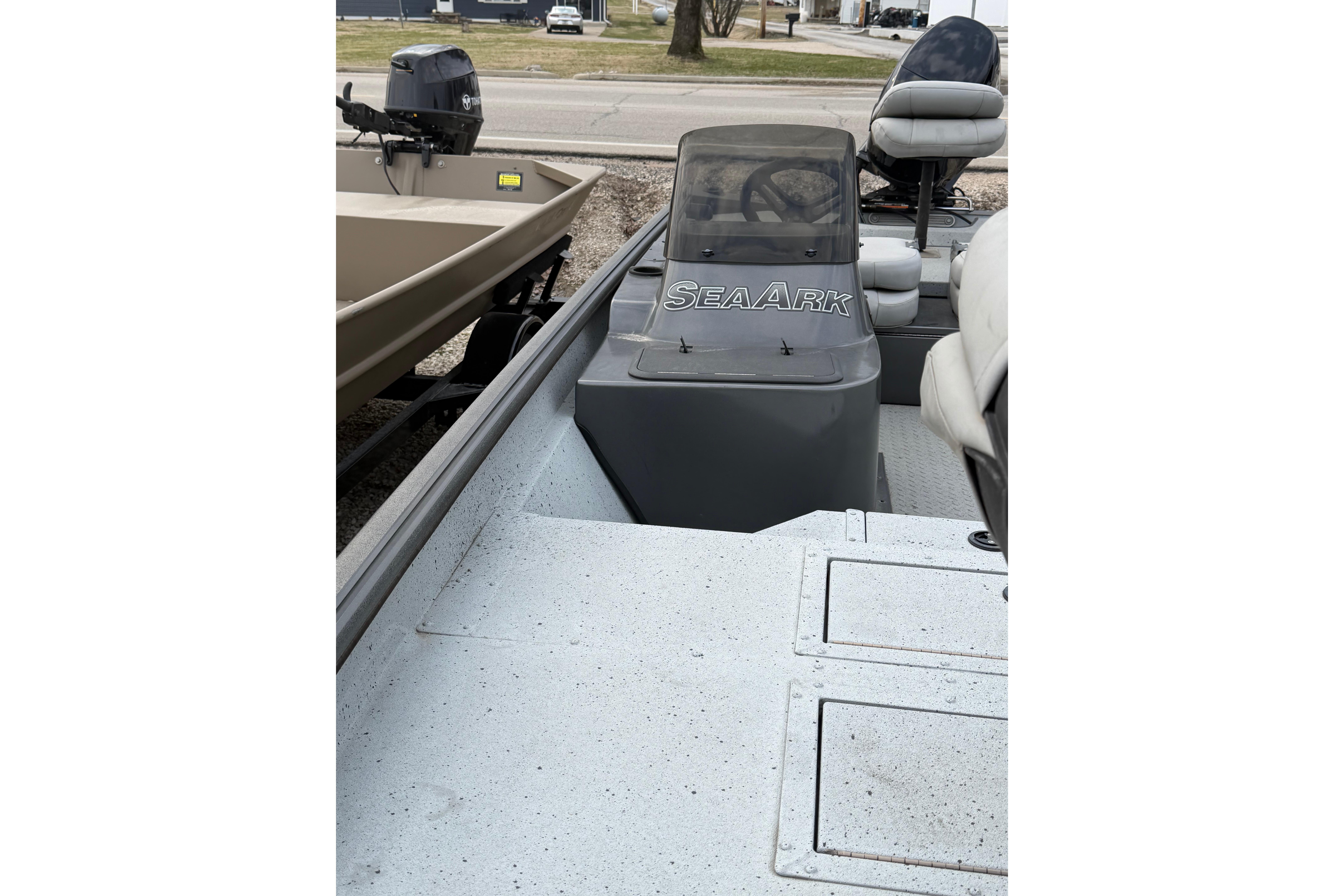 2023 SeaArk 180 RX boat interior with steering console and seating.