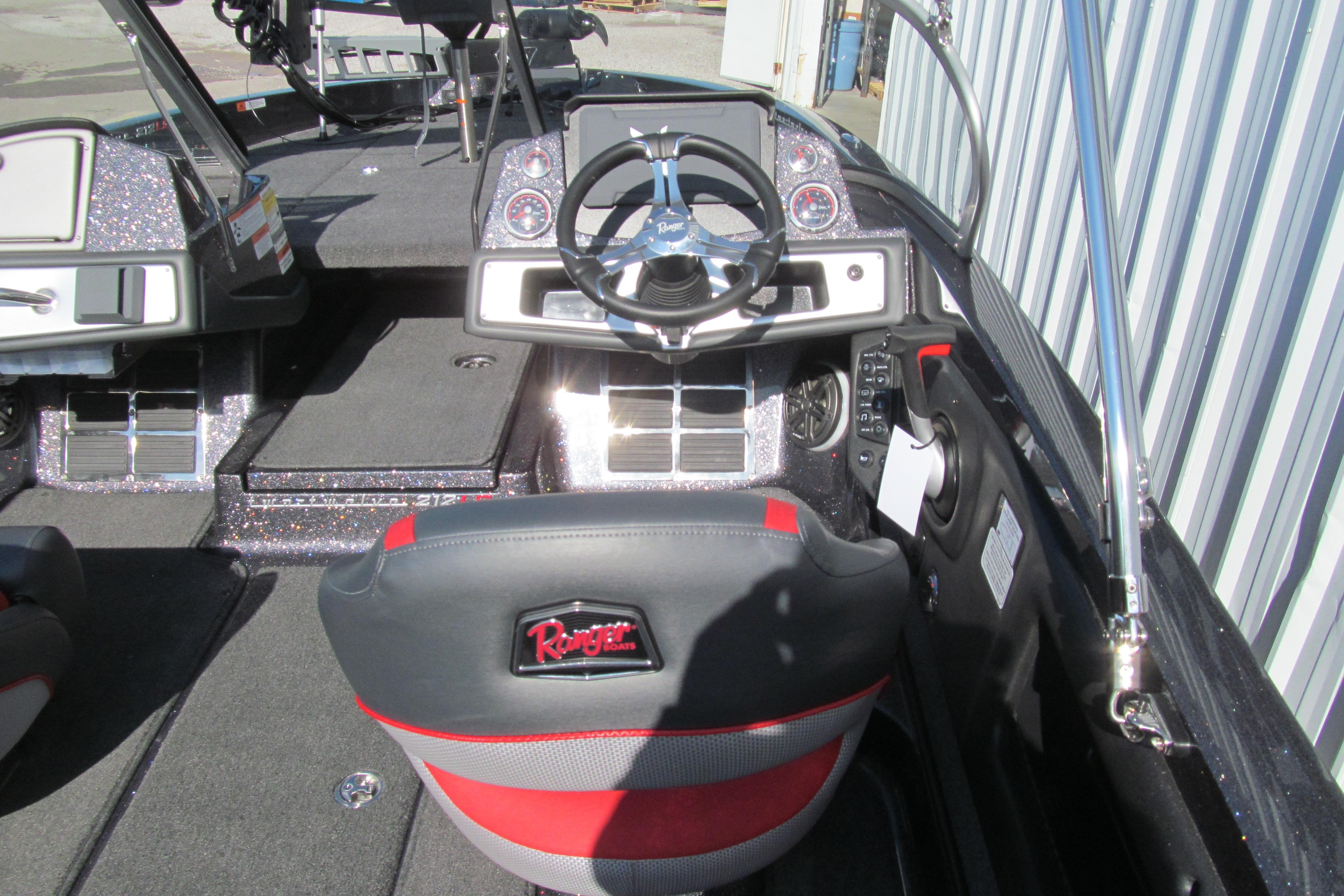 Interior of 2026 Ranger 212LS boat with steering wheel and dashboard.