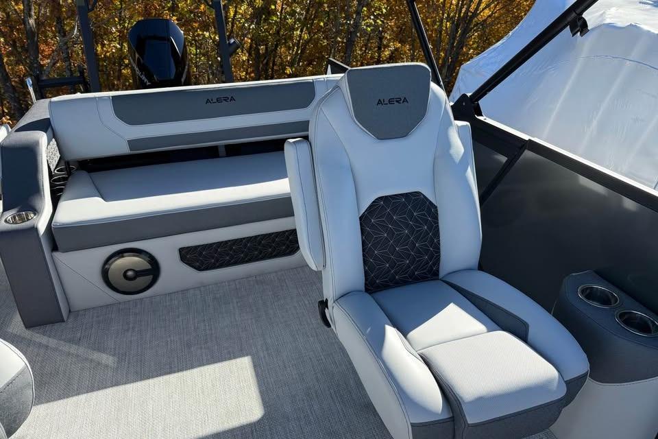 2026 Alera M 23L boat interior with modern seating and cup holders.