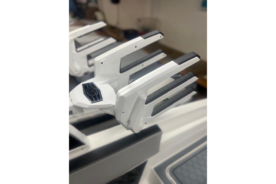 2025 Cobalt CS23 Surf boat detail, featuring sleek white and black design elements.