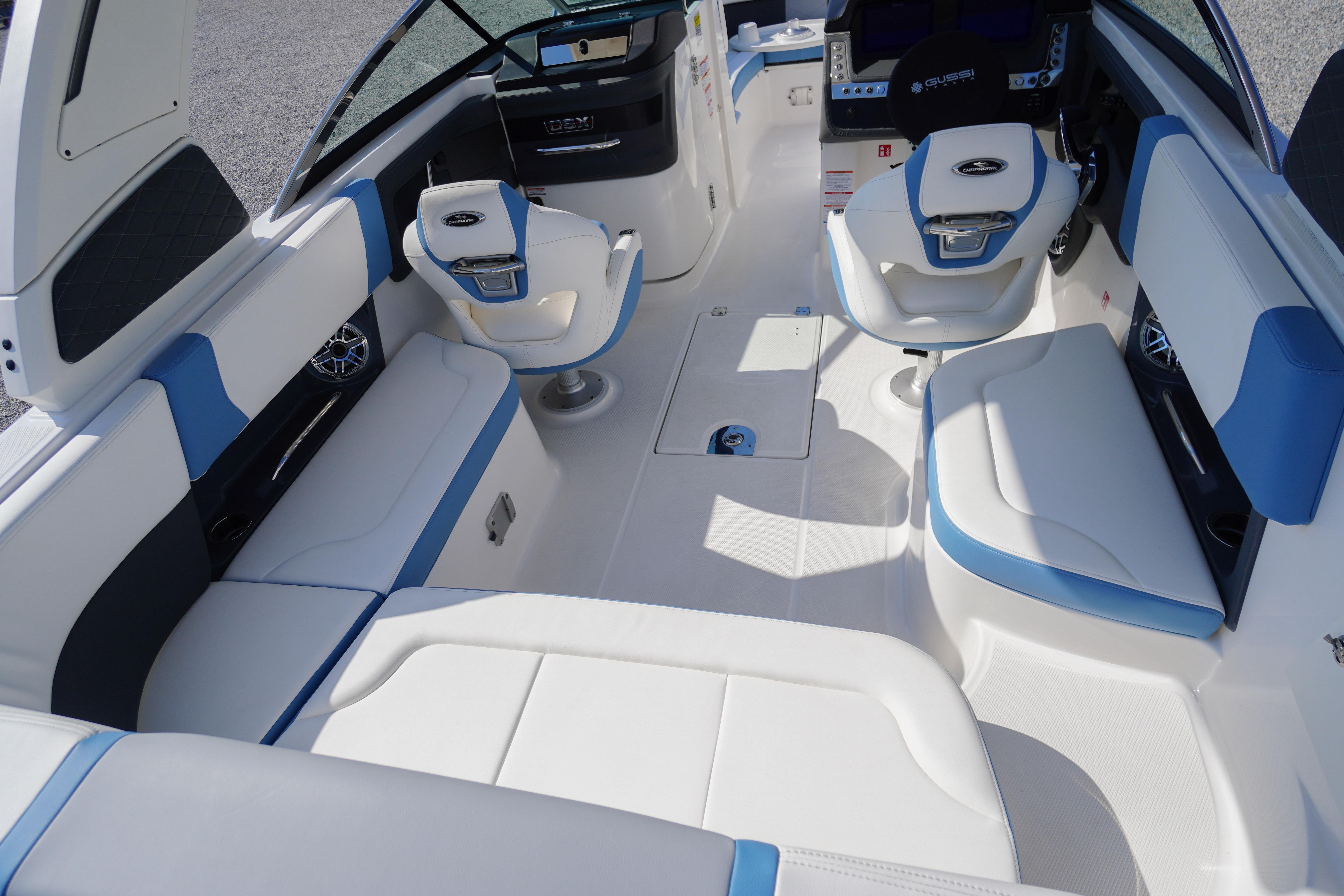 2026 Chaparral 270 OSX boat interior with white and blue seating, modern design.