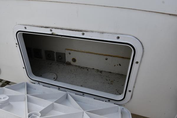 Open storage compartment on a 2021 Eastern 248 Center Console boat.