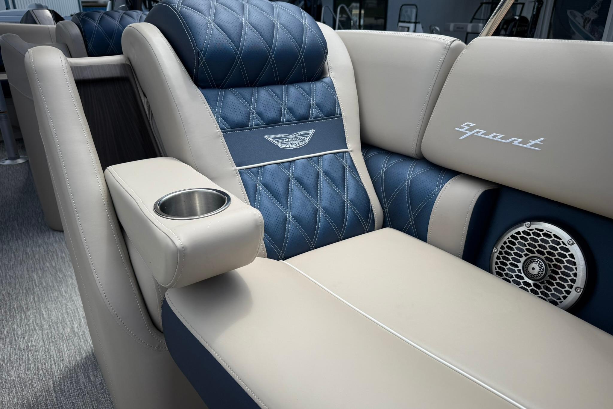 Luxurious seating in 2026 Bennington 27 QSBAT2 boat with cup holder and speaker.