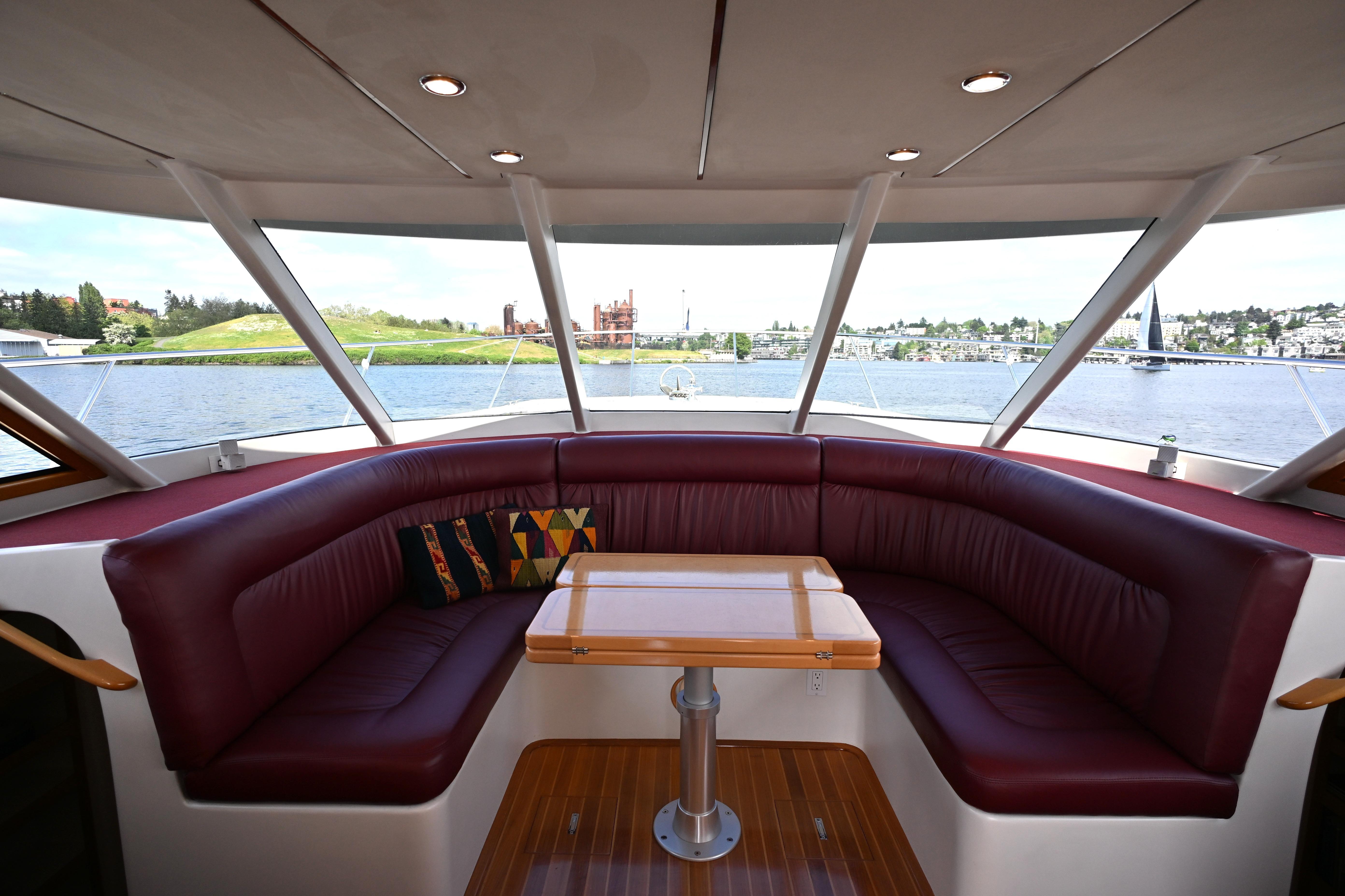 Luxurious interior of 2002 Roger Hill Power Cat 41.4 with panoramic windows and plush seating.