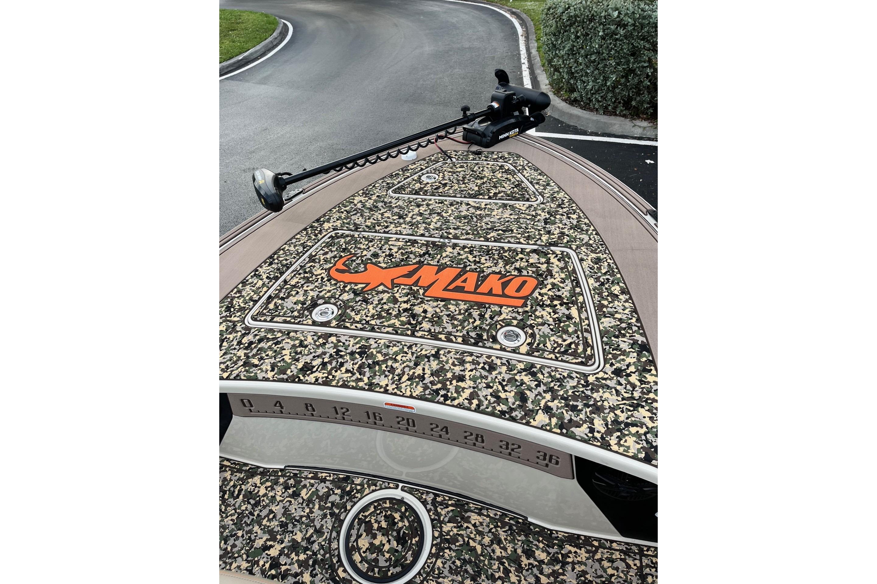 2026 Mako 18 Pro Skiff Backwater Edition with camo design and trolling motor.