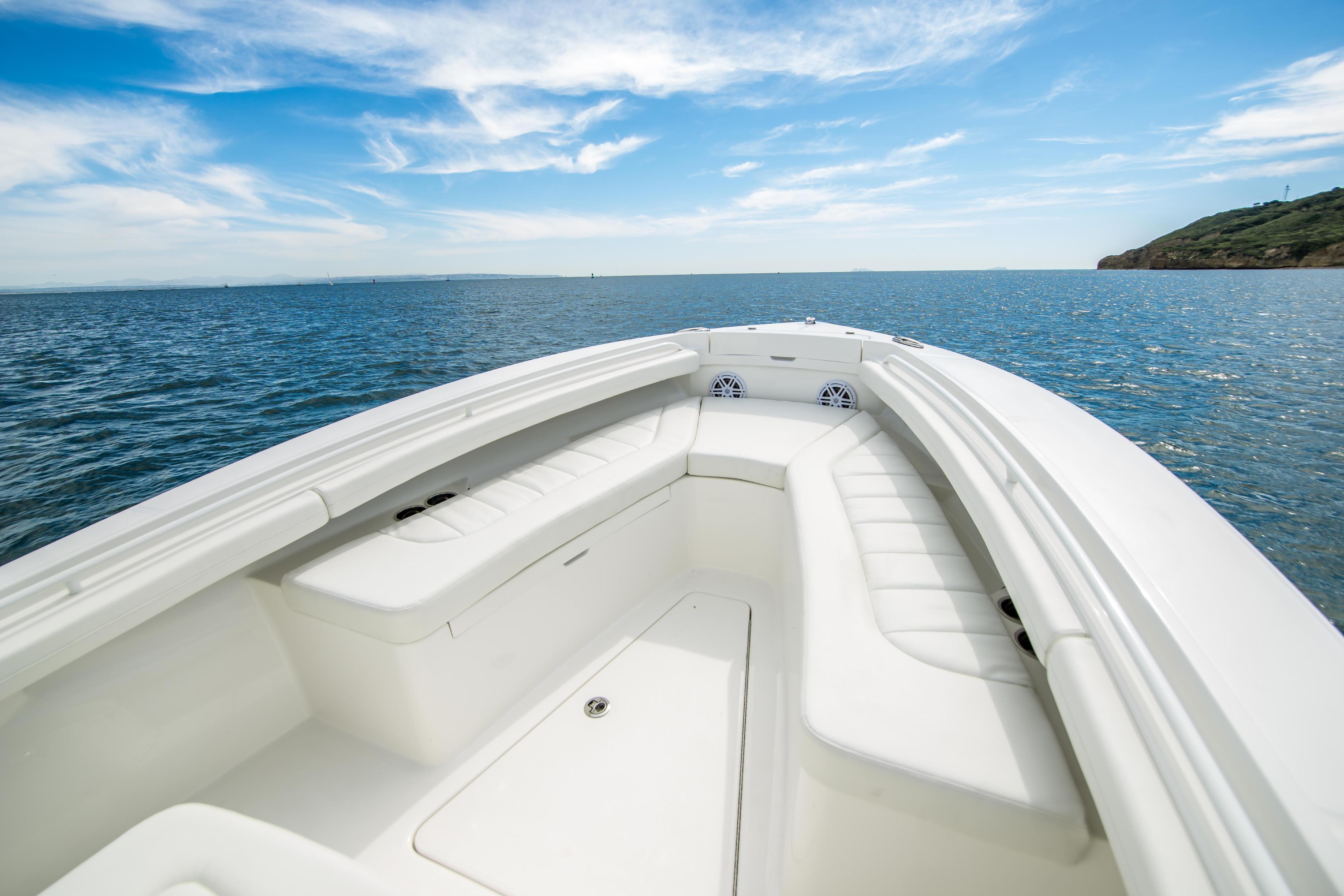 2026 Regulator 23 boat interior with ocean view and clear blue sky.