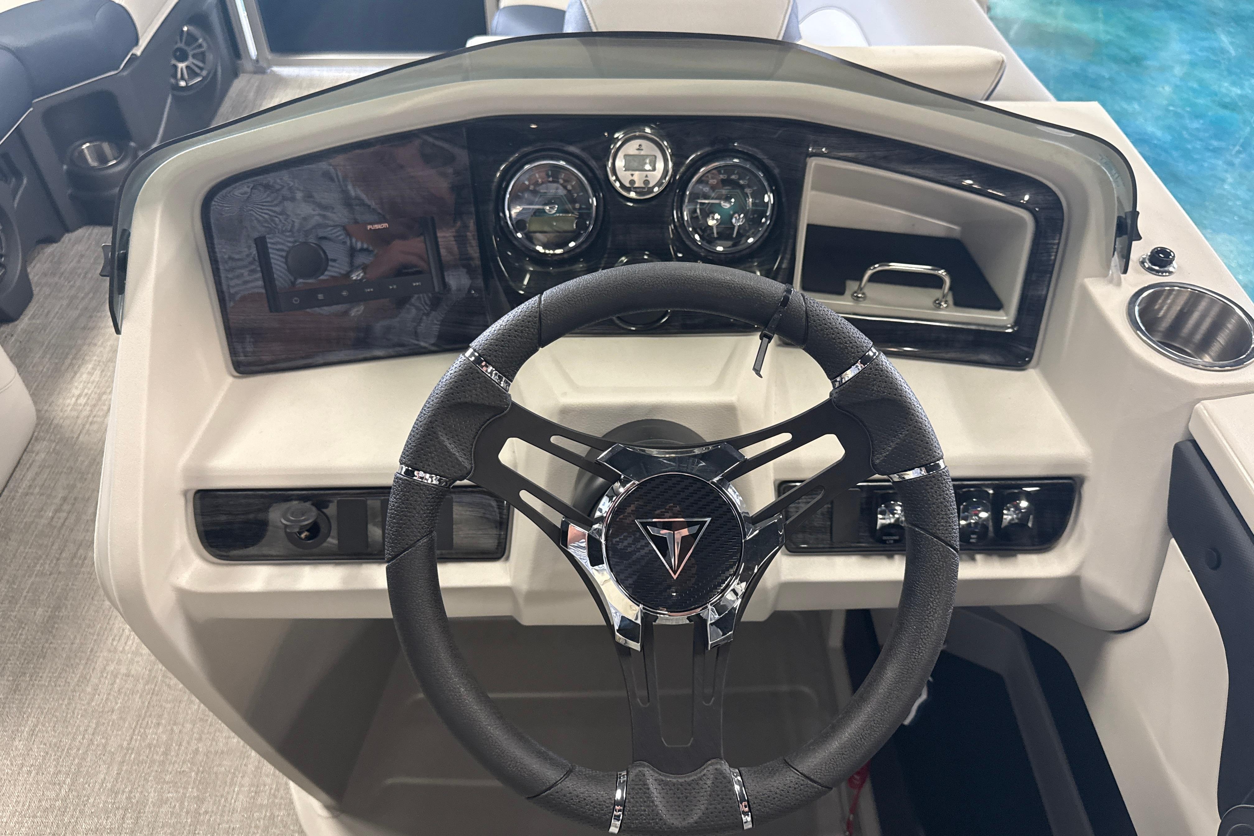 2026 Tahoe Pontoon LTZ Quad Lounger dashboard with steering wheel and controls.