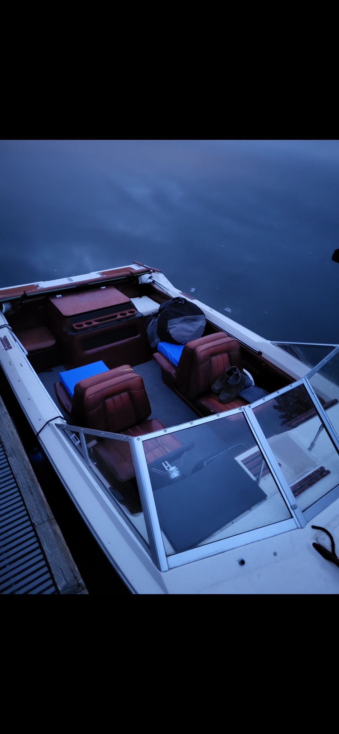 1977 Bayliner Jamaica boat by calm water.
