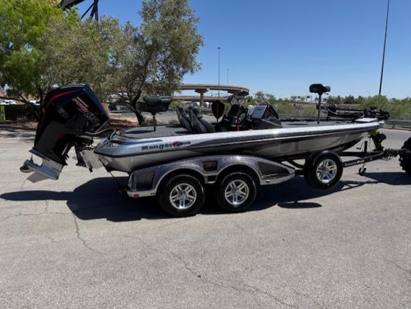 2025 Ranger Z519R Cup-Equipped boat on trailer in sunny outdoor setting.