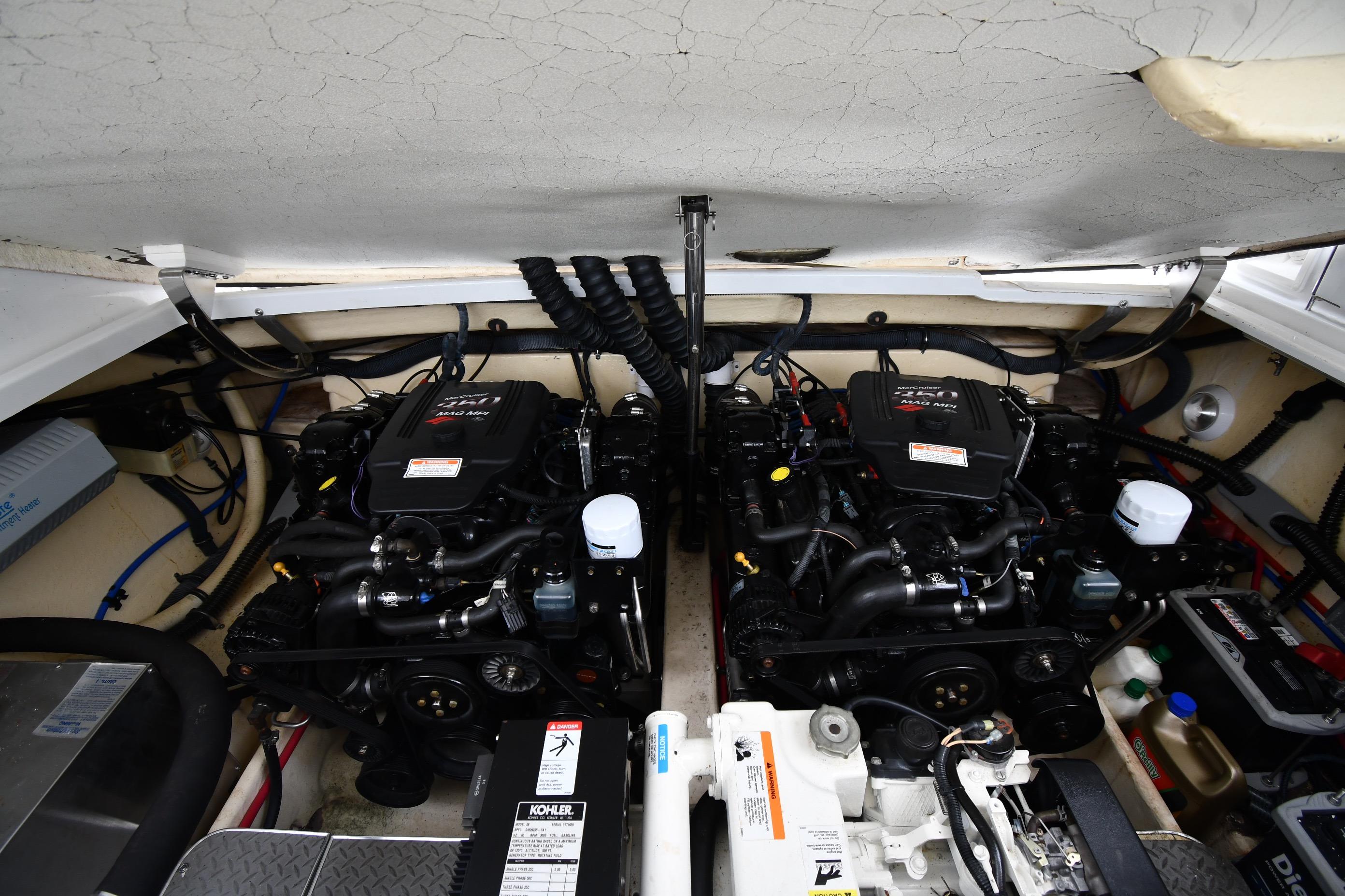 Engine compartment of a 2004 Formula 330 Sun Sport boat, featuring dual engines.