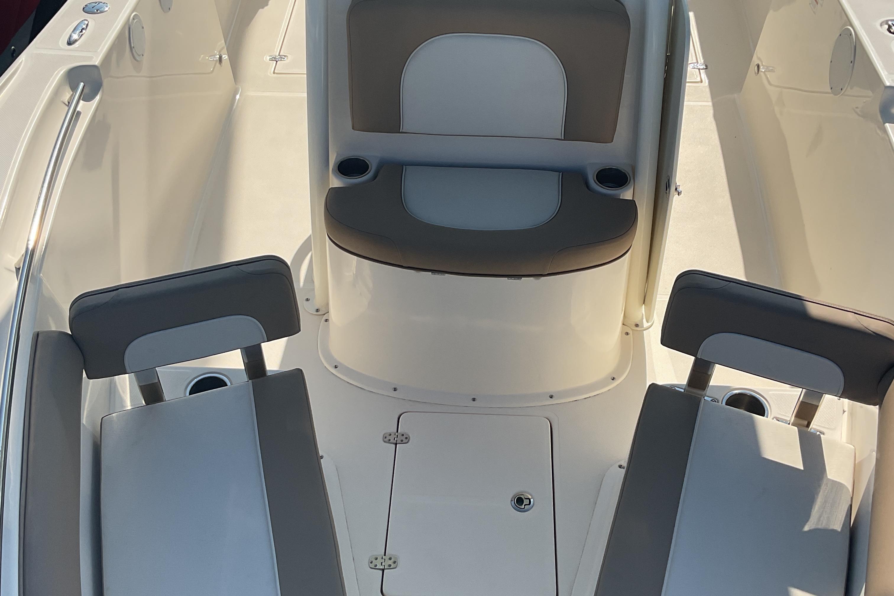 2023 Sea Born SX239 Offshore boat interior with seating and cup holders.