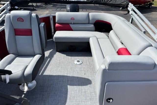 2026 Sun Tracker Party Barge 20 DLX interior with gray and red seating.
