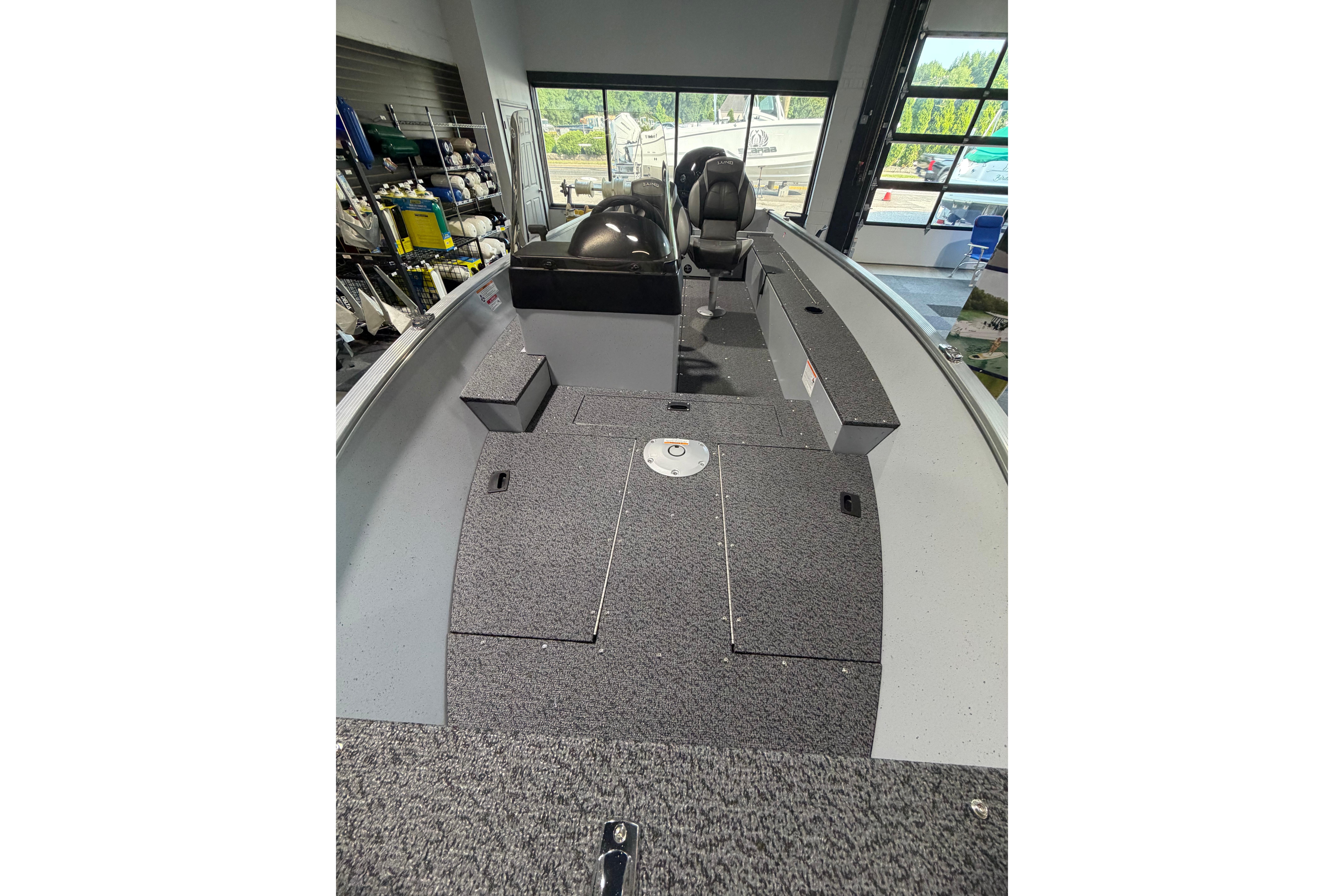 2027 Lund 1600 Fury SS boat interior with seating and storage compartments.