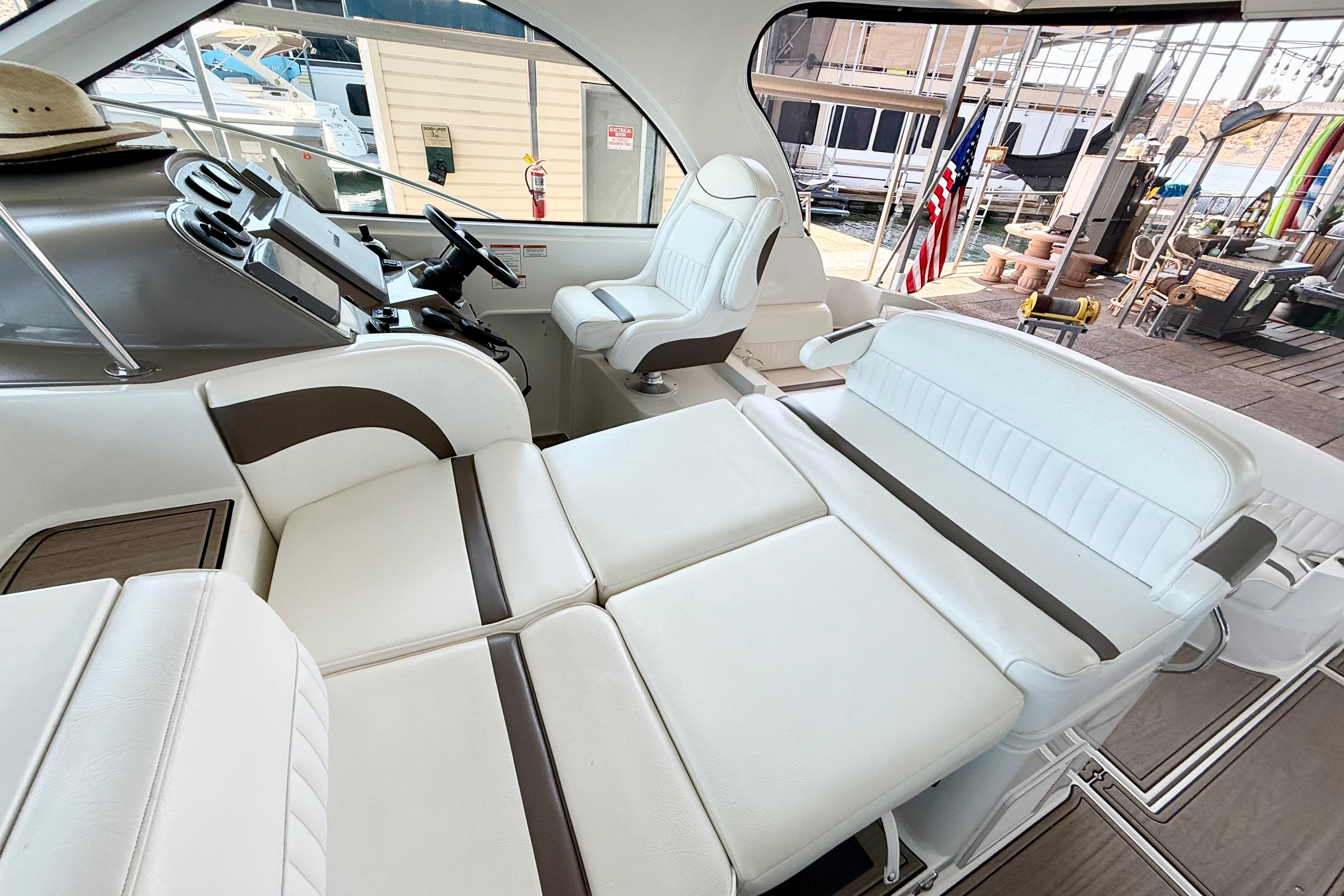 Luxurious interior of 2011 Cruisers Yachts 390 Sports Coupe with plush seating and helm.
