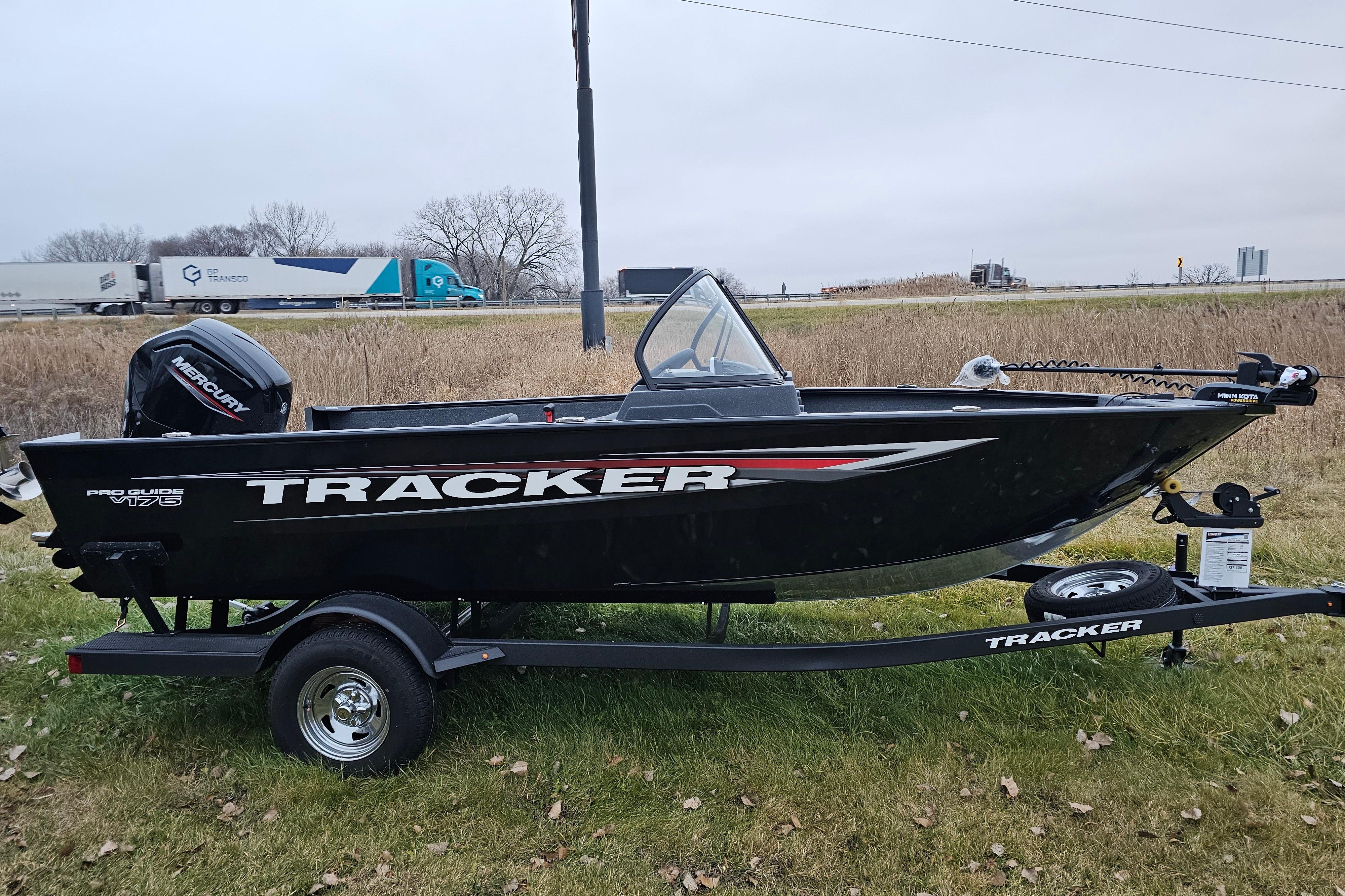 2026 Tracker Pro Guide V-175 WT boat on trailer, parked on grass.