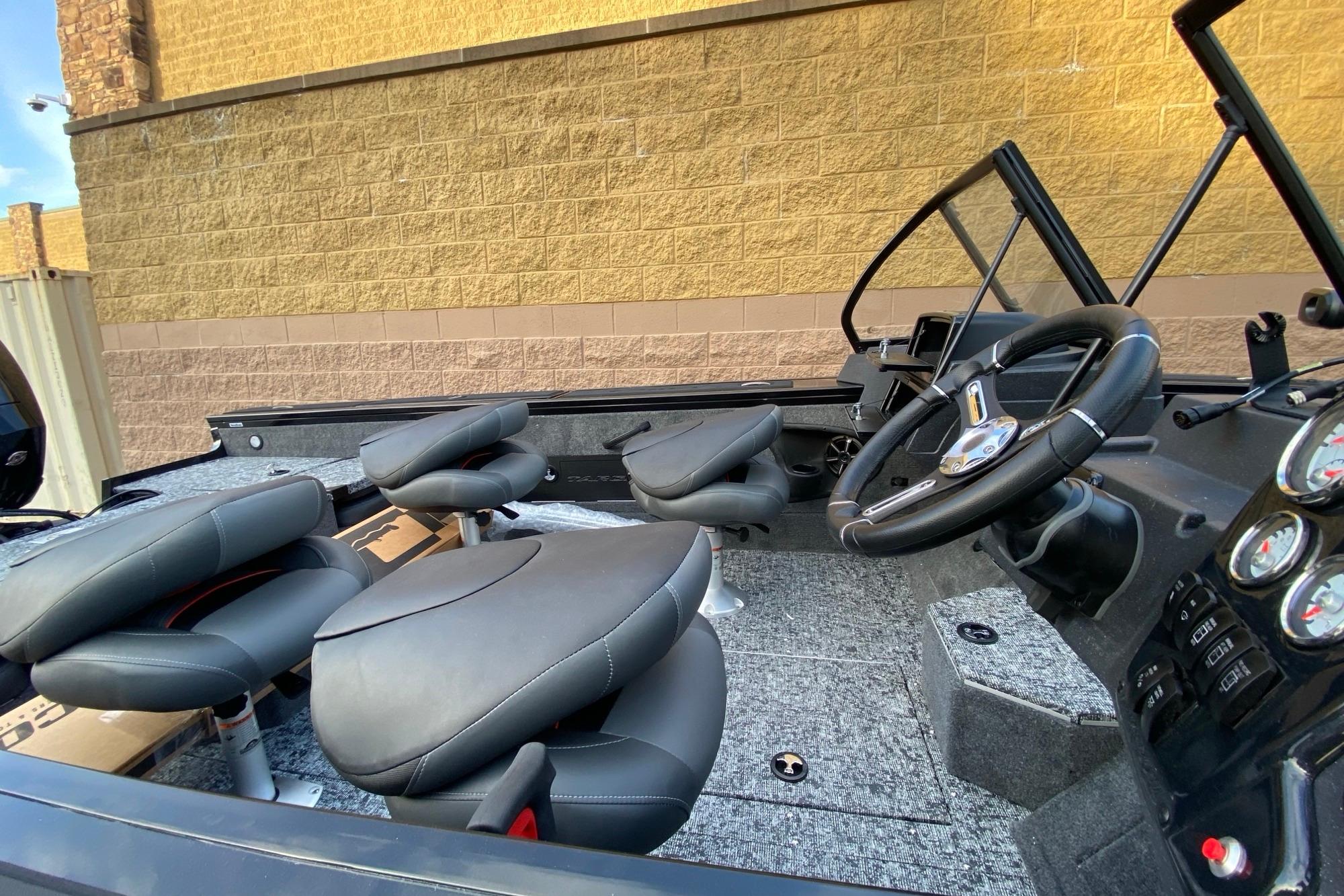 2026 Tracker Targa V-18 Combo boat interior with steering wheel and seating.