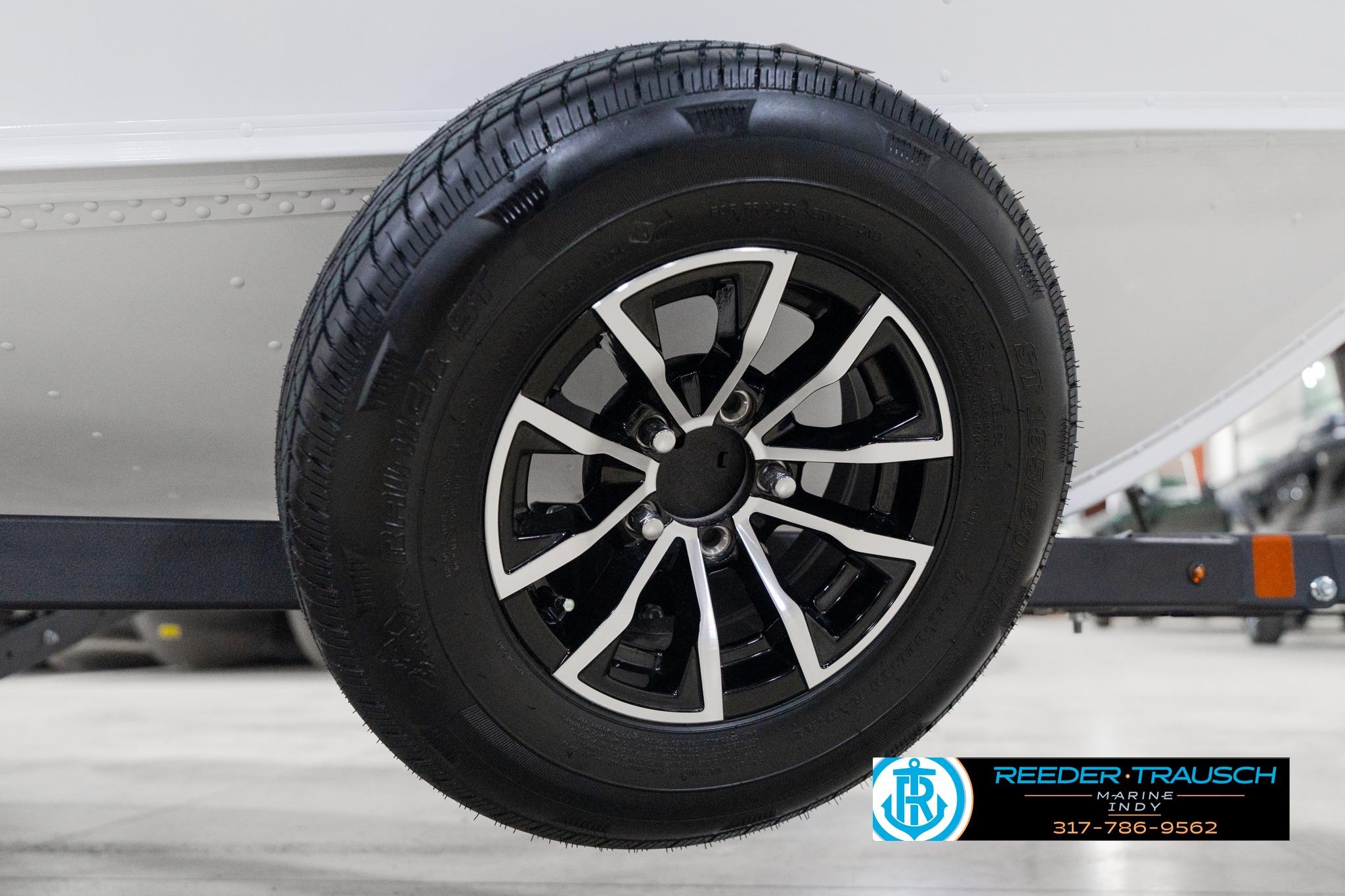 2026 Lund 1700 Explorer Sport trailer wheel with black and silver alloy rim.
