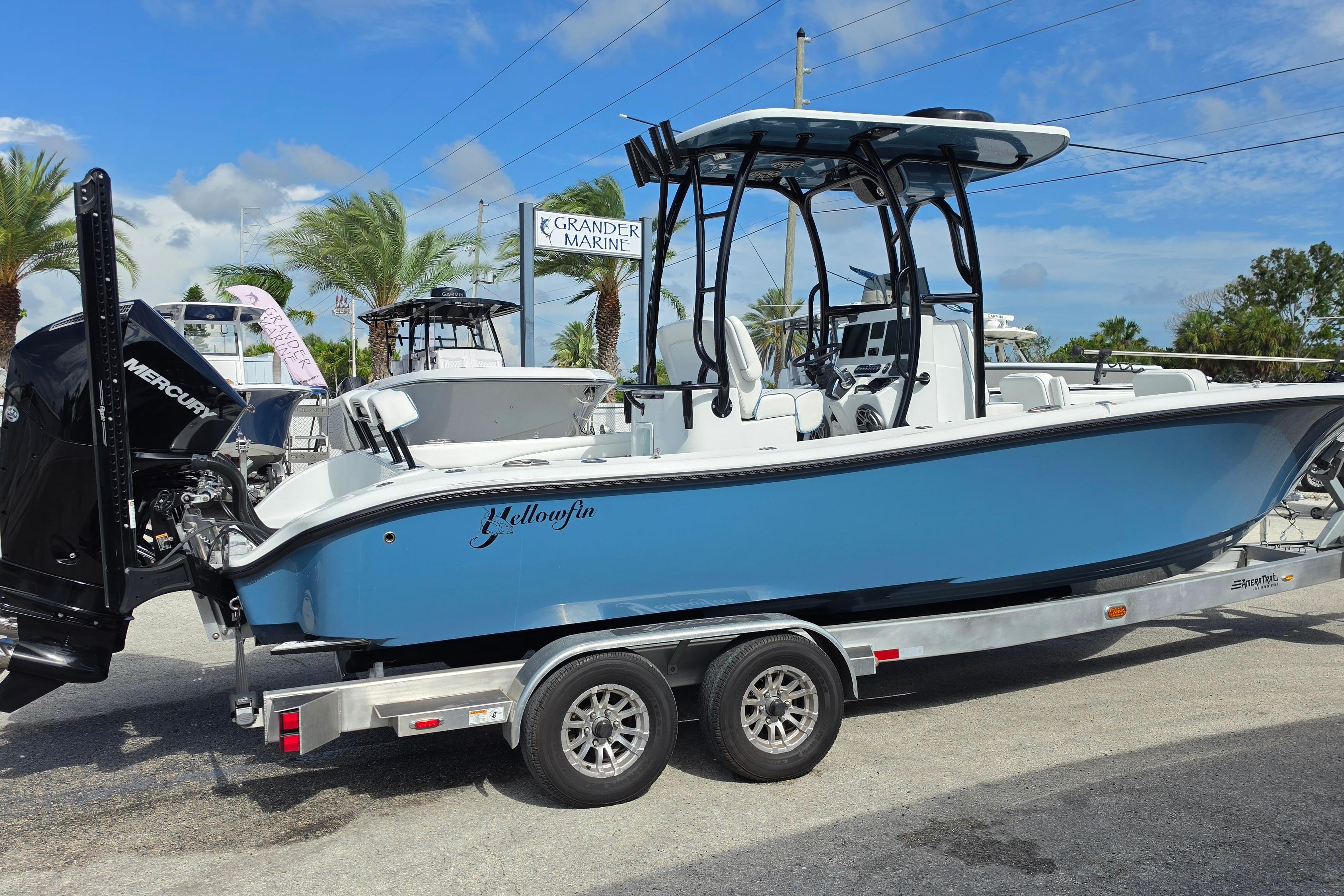 2025 Yellowfin 26 Hybrid boat on trailer at Grander Marine dealership.