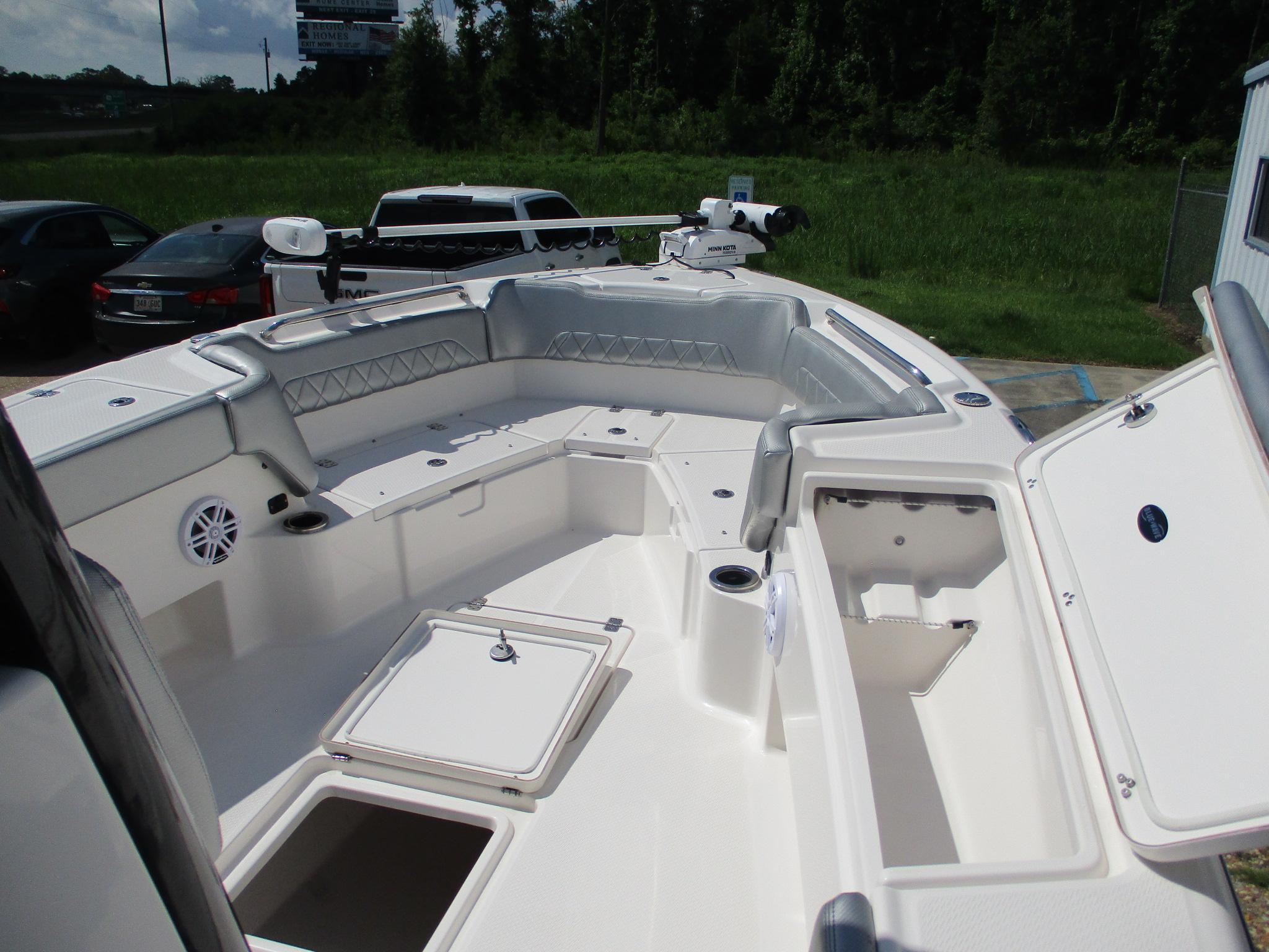 2024 Blue Wave 2800 Makaira boat interior with spacious seating and storage compartments.