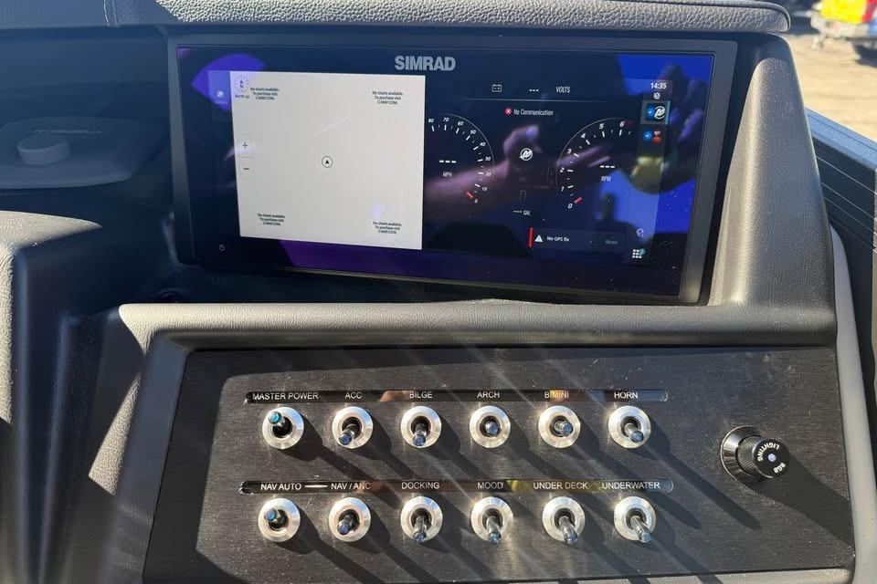 Control panel of 2026 Alera M 25Q boat with Simrad display and switches.