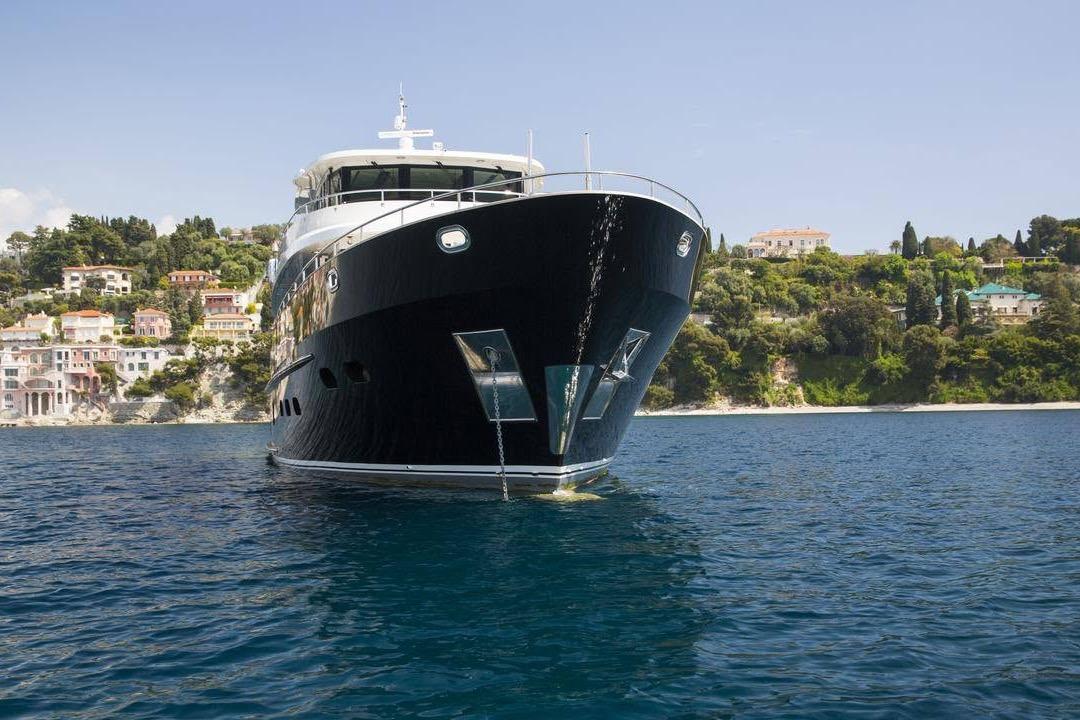 Luxurious 2014 Fifth Ocean Yachts 24m Explorer Yacht on serene coastal waters.