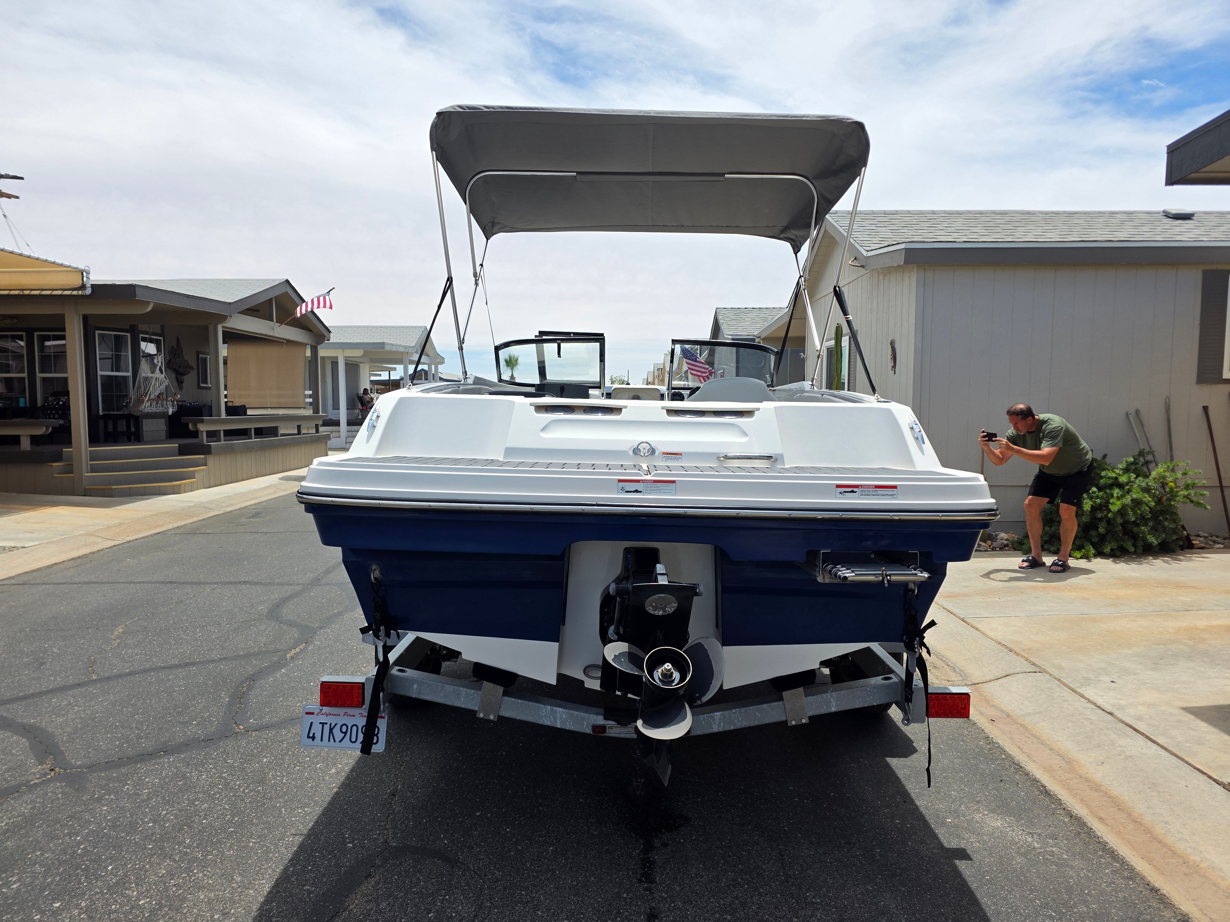 2021 Bayliner VR4 Bowrider I/O on a trailer in a residential area.