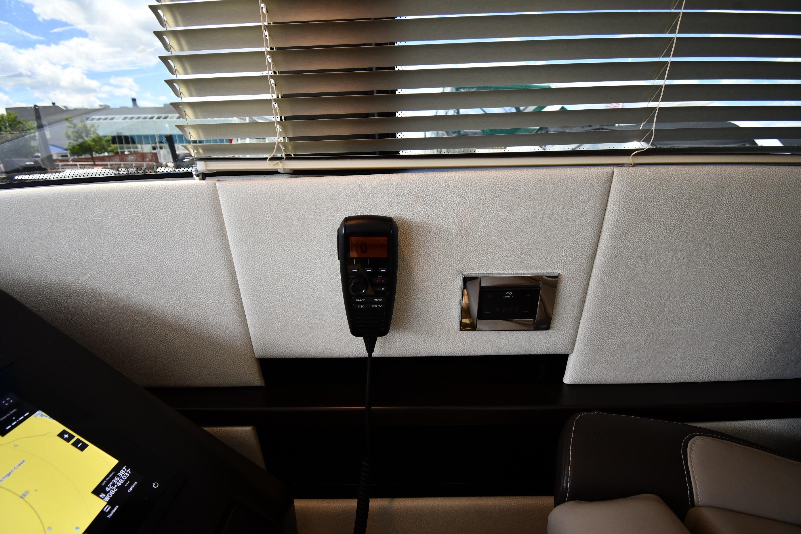 Interior of 2024 Fairline G50 Targa yacht with control panel and blinds.