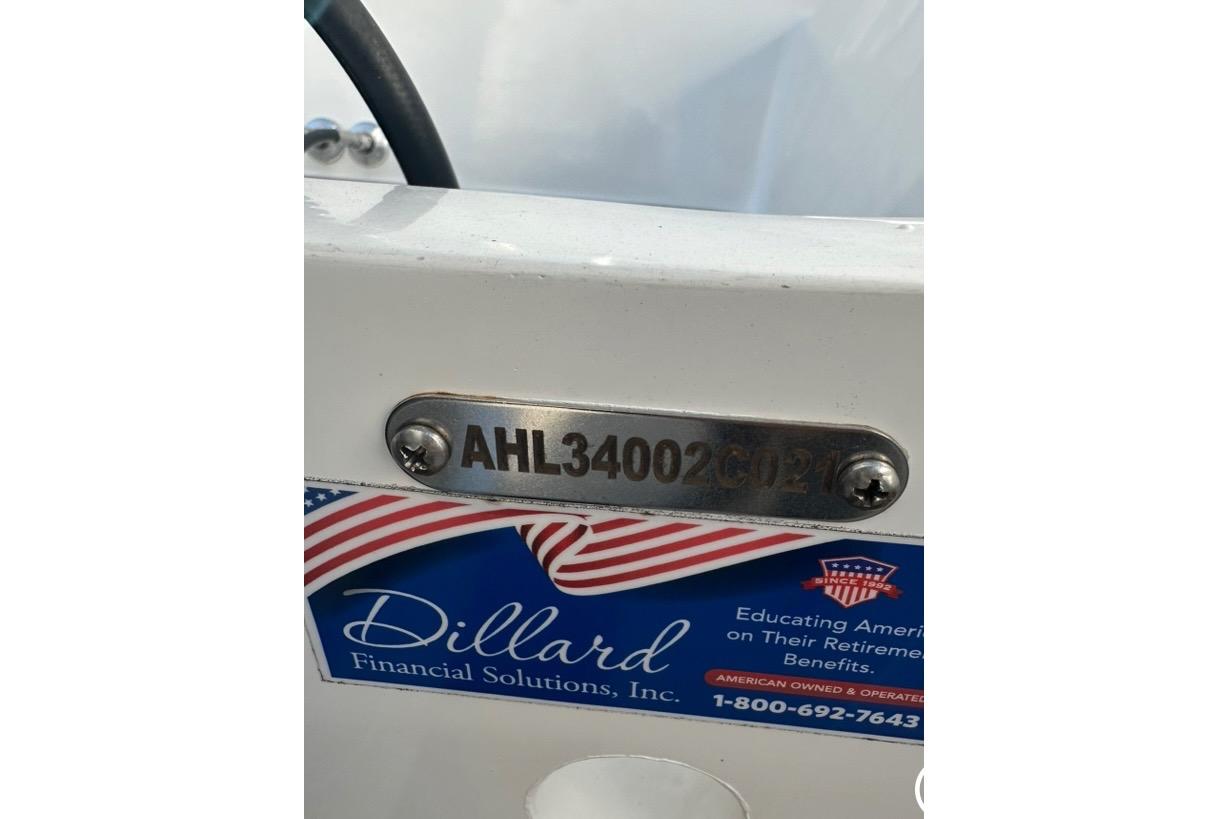 2021 Custom Infusion 34 CC boat with identification plate and Dillard Financial Solutions sticker.