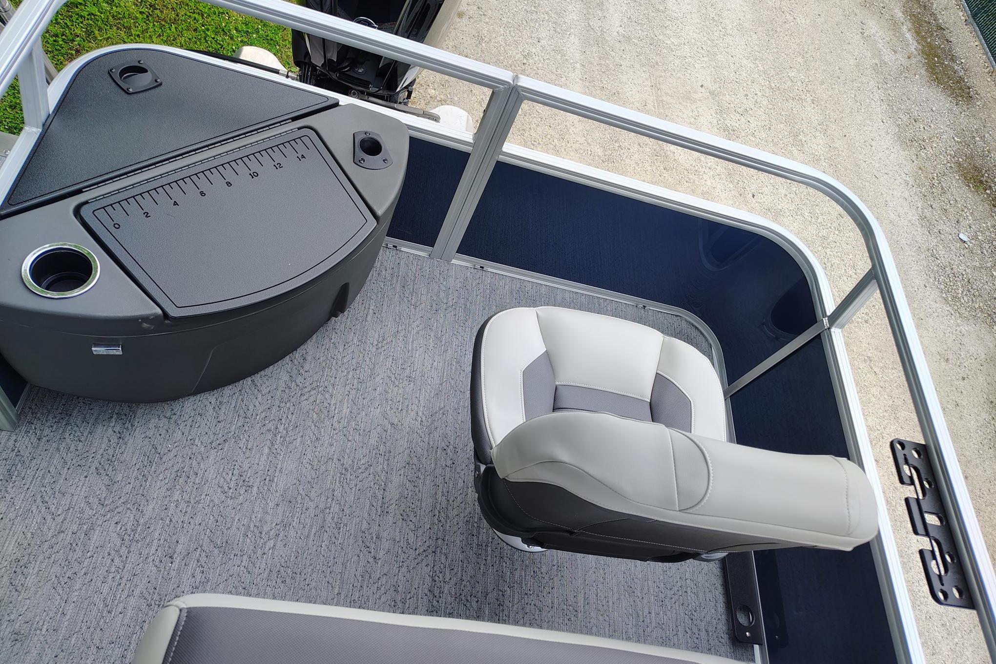 2026 Sun Tracker Bass Buggy 18 DLX boat interior with seating and measuring station.