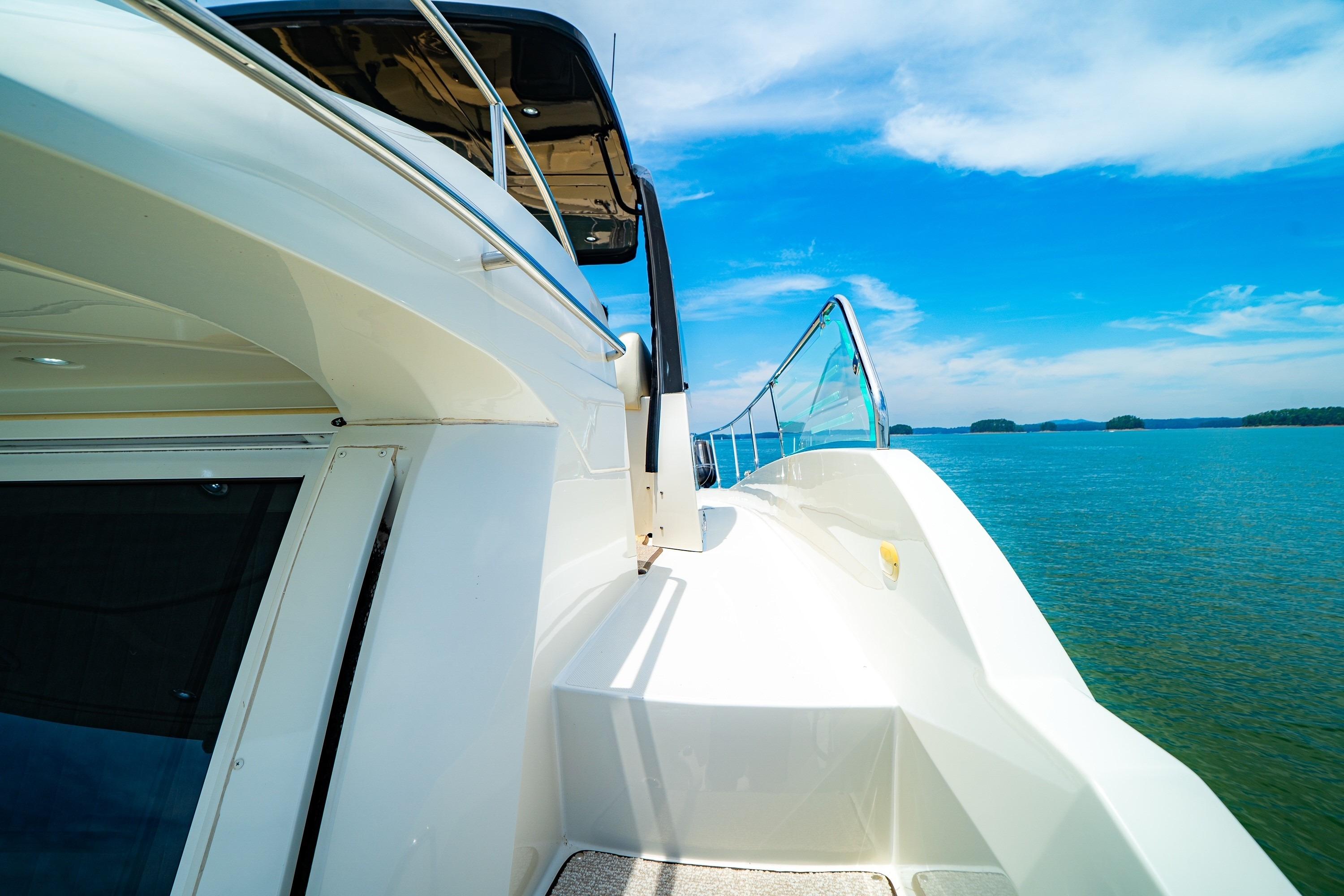 2011 Carver 44 Sojourn yacht on serene blue waters under a clear sky.