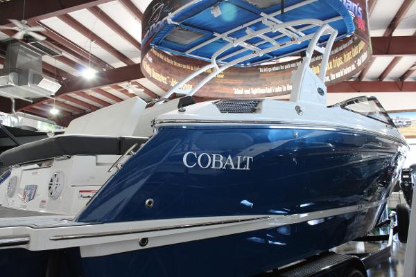 2025 Cobalt R6 boat in showroom, blue exterior, sleek design.