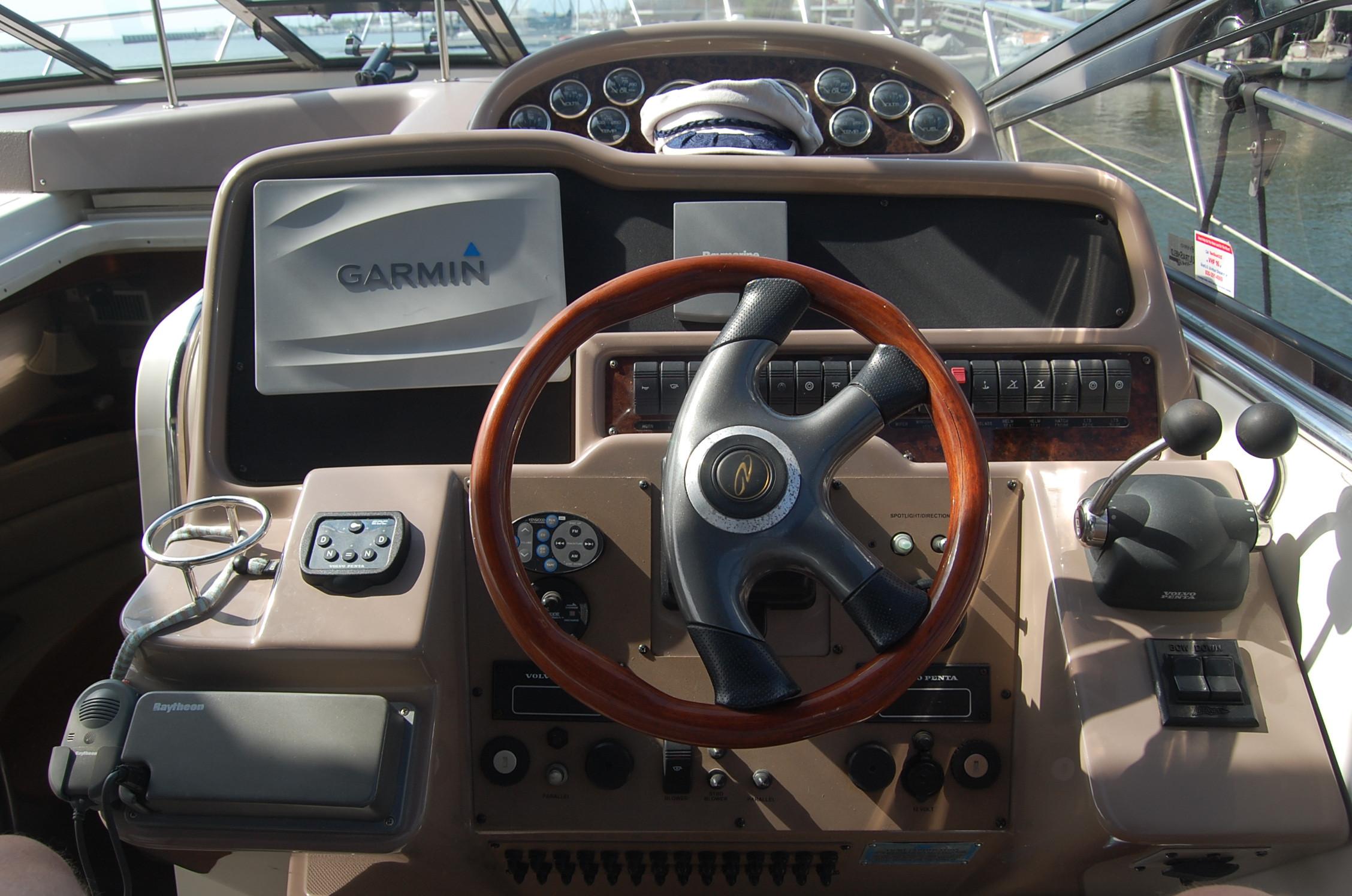 Helm of 2002 Regal Commodore 4260 yacht with Garmin navigation system.