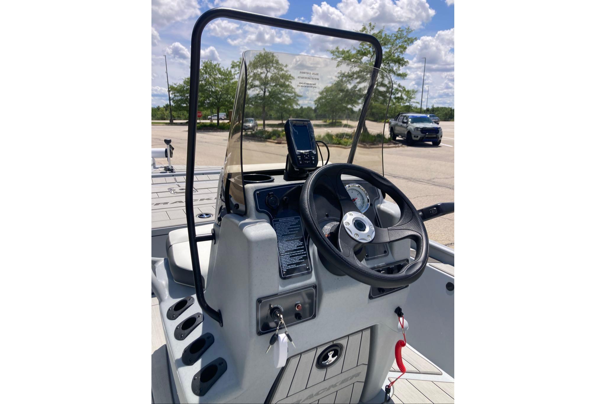 2026 Tracker Bass Tracker Classic CC boat console with steering wheel and controls.