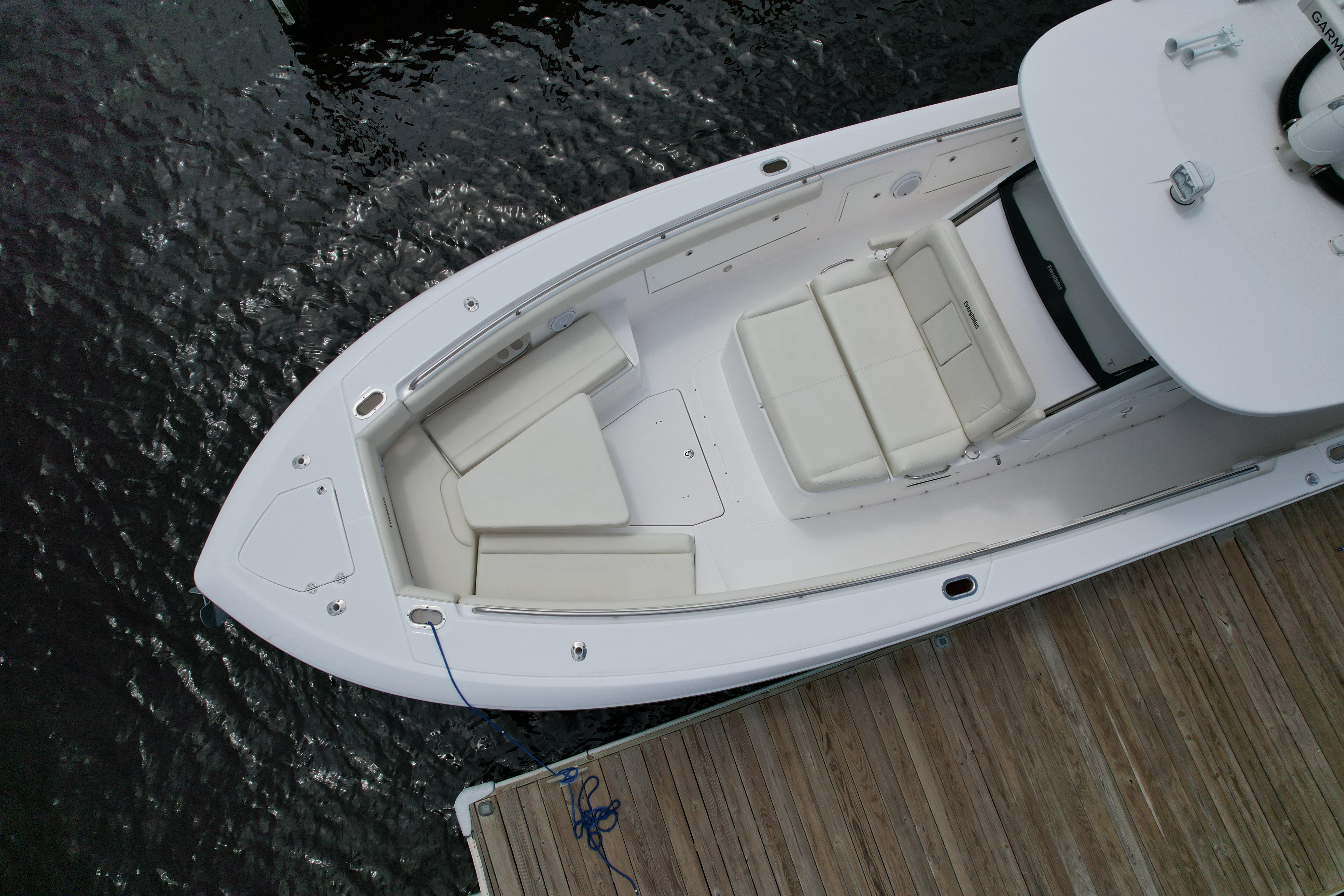 Overhead view of 2017 Everglades 435 Center Console boat docked by wooden pier.