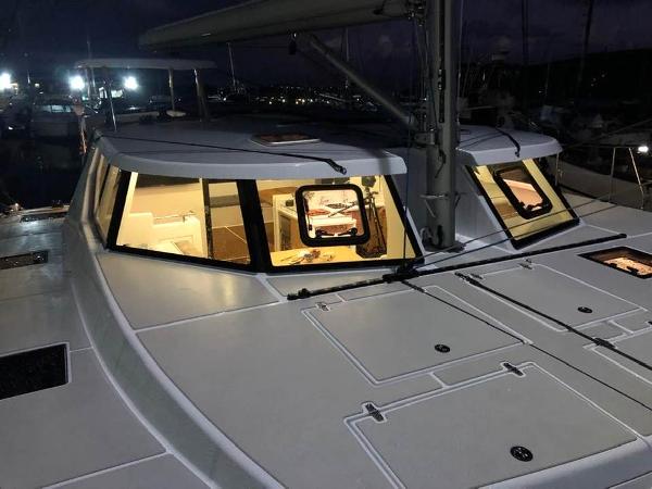 Modern Vision 444 yacht at night, illuminated interior, 2025 model.