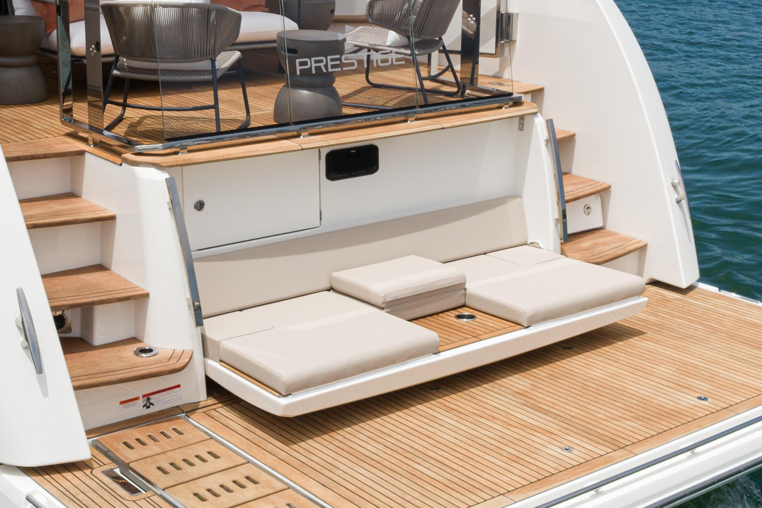 2024 Prestige X60 yacht with elegant teak deck and luxurious seating area.