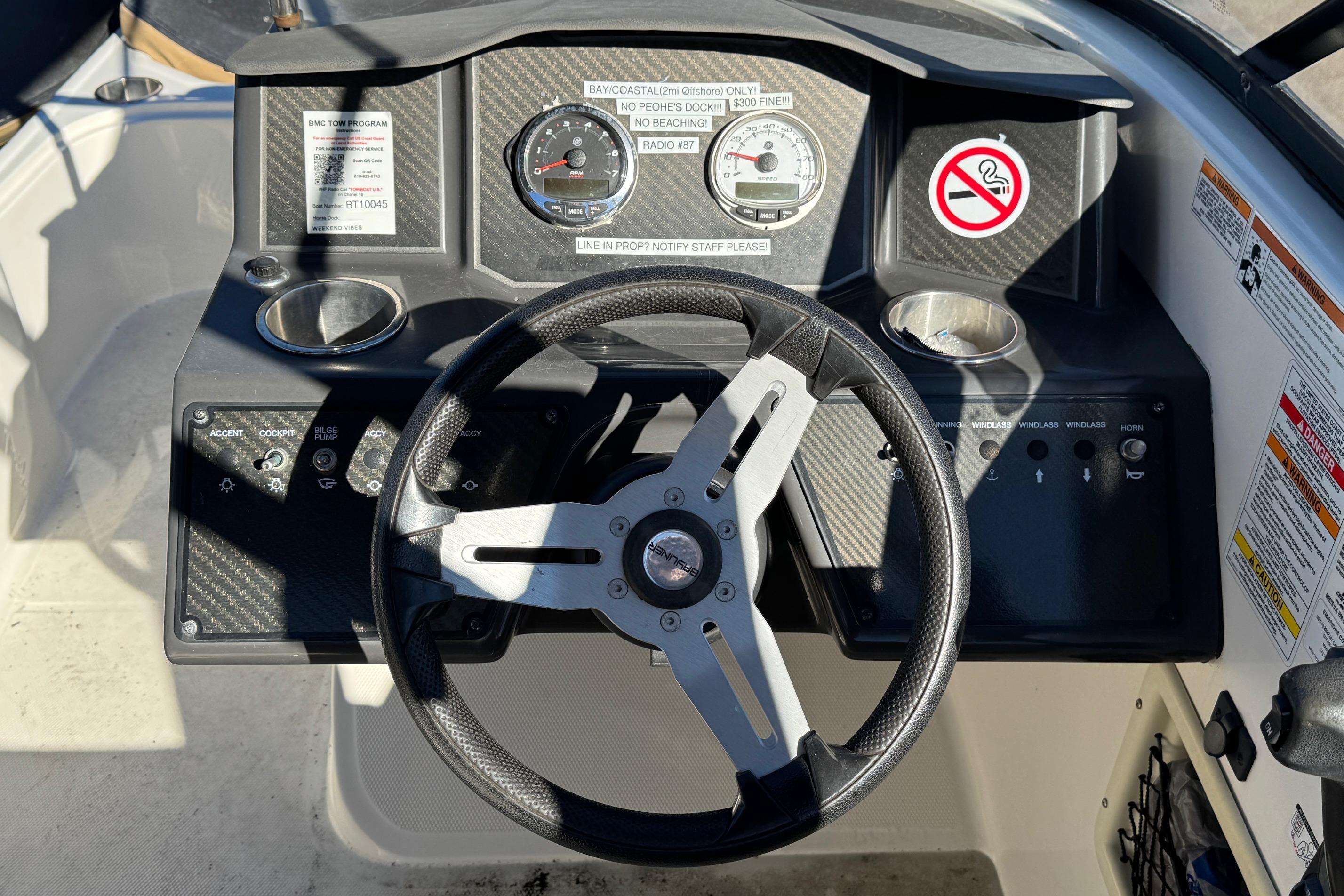 2022 Bayliner VR6 Bowrider OB dashboard with steering wheel and control panel.
