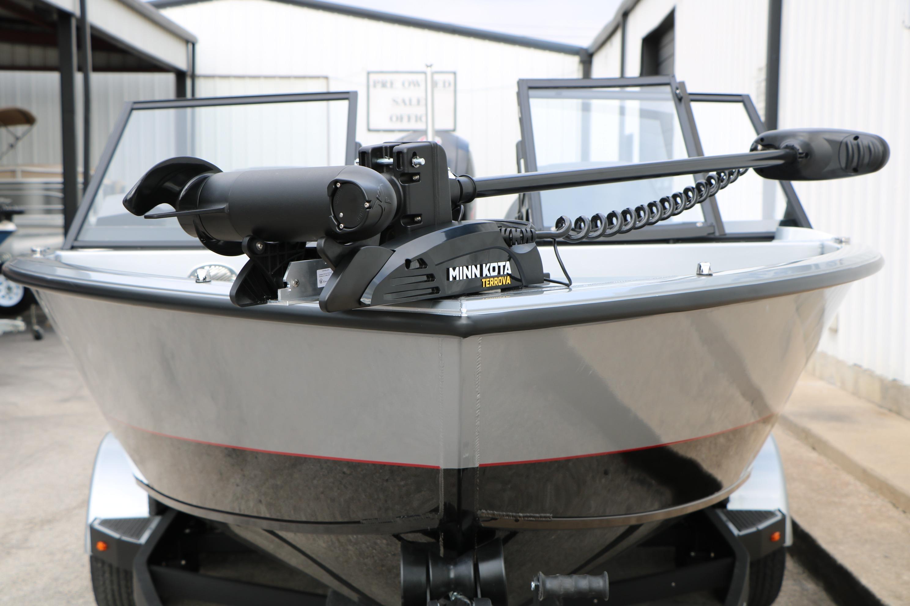 2026 Vexus ADX 190 boat with Minn Kota Terrova trolling motor, parked outdoors.