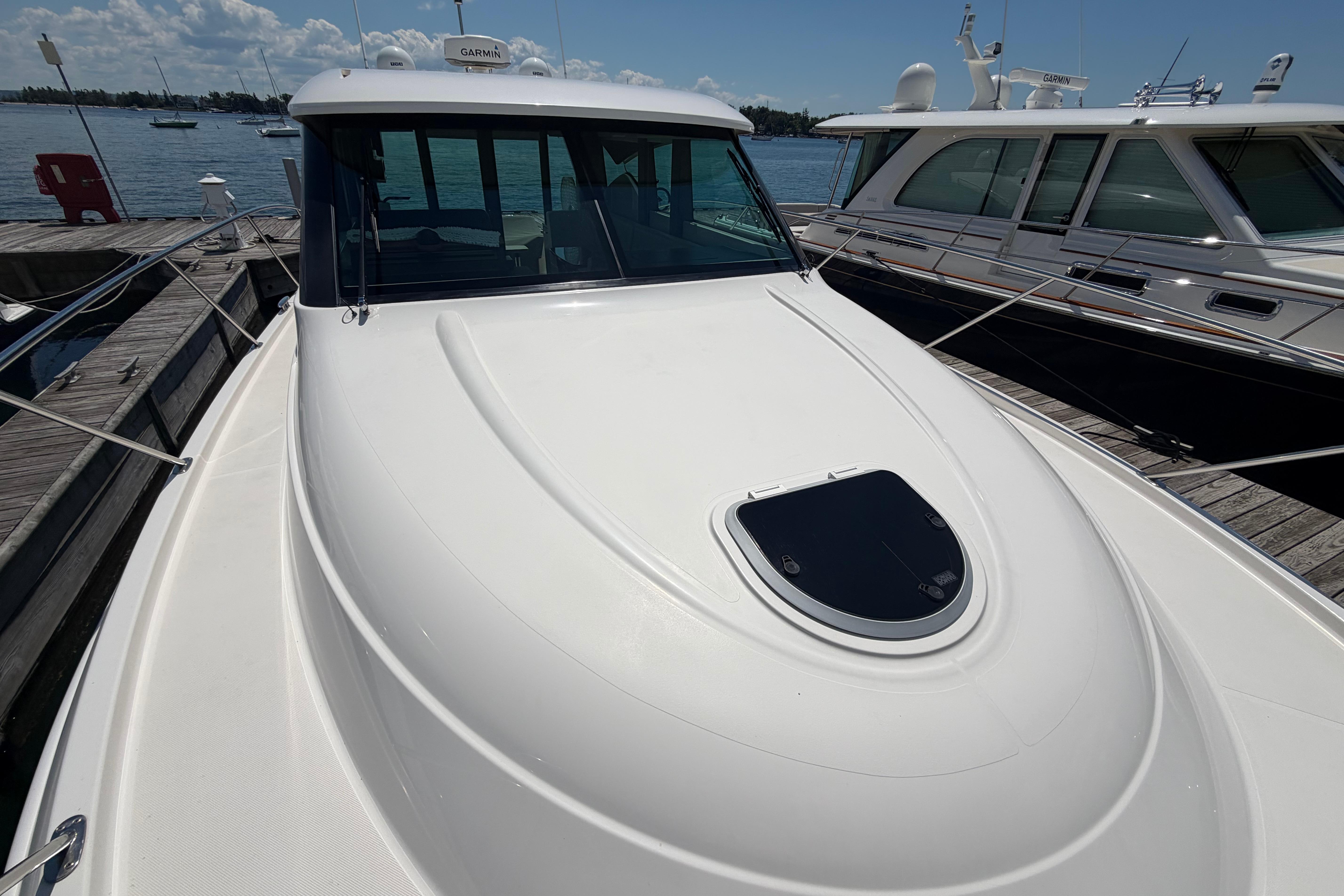2016 Tiara Yachts C39 Coupe docked, showcasing sleek design and spacious deck.