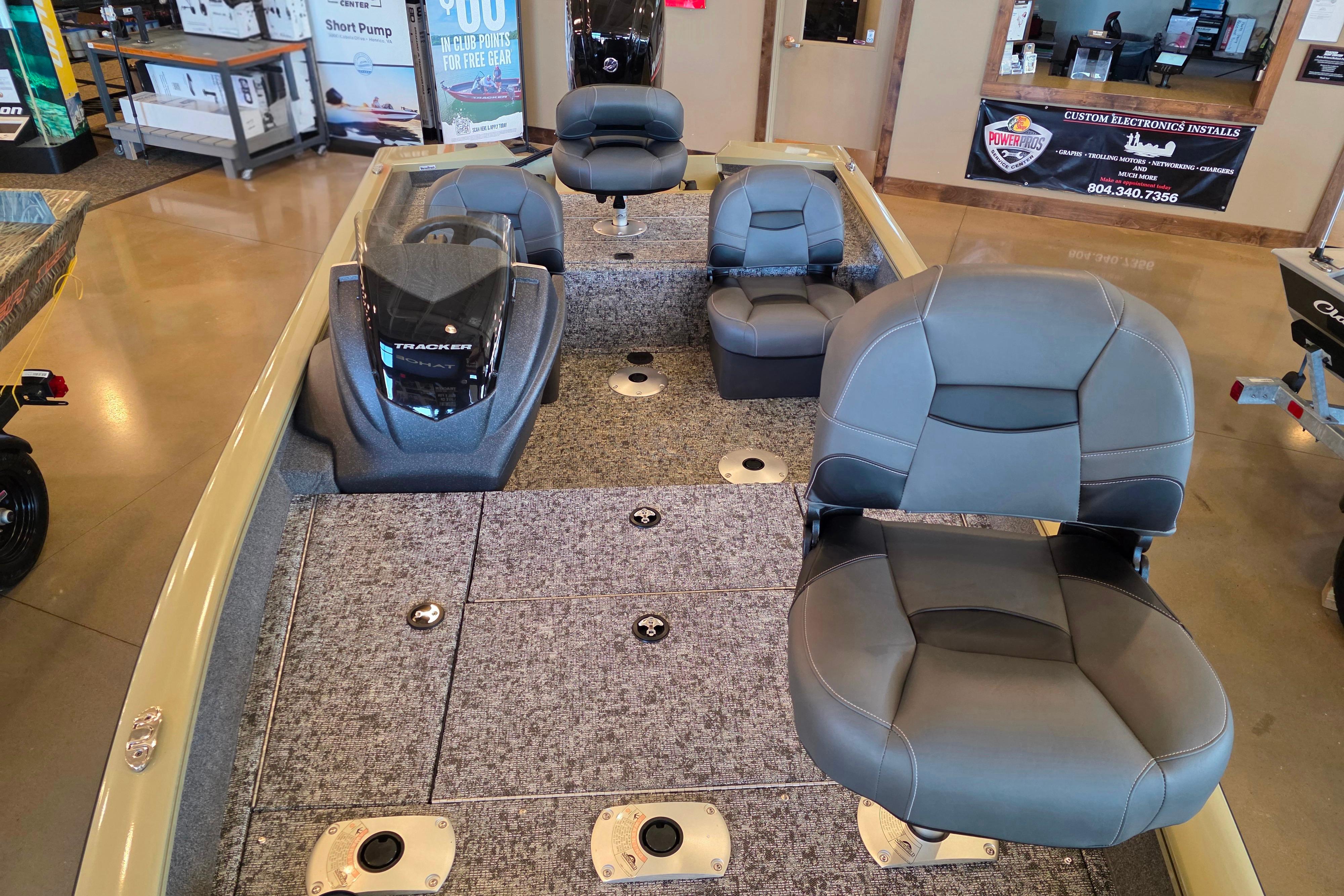 2026 Tracker Pro Team 175 Crappie Edition boat interior with gray seating and carpeted deck.