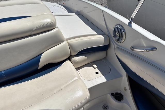 Interior of a 2012 Tahoe Q8 SSi boat with white and blue seating.