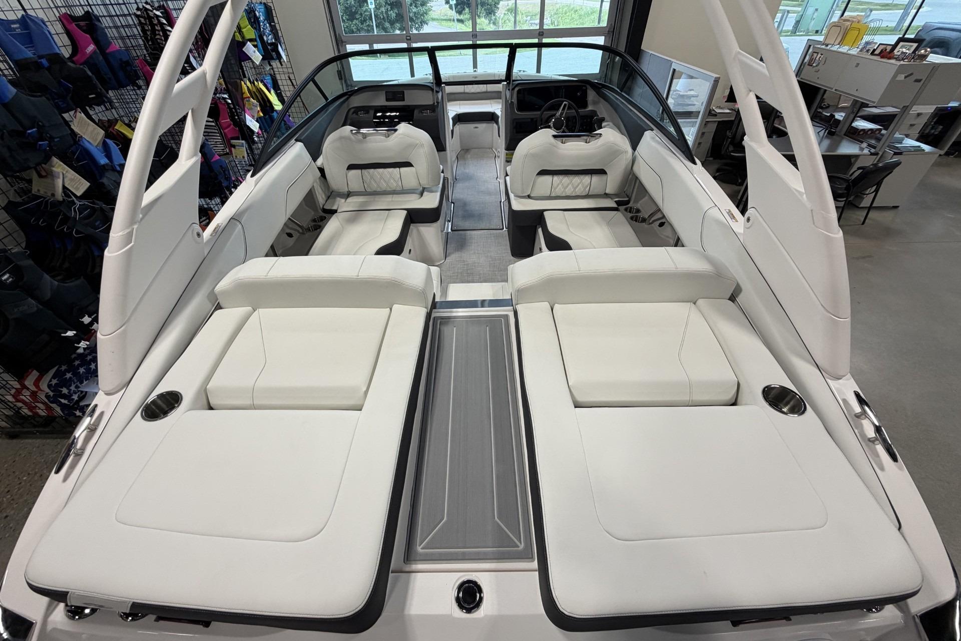 2027 Regal LS2 boat interior with white seating and modern design in showroom.